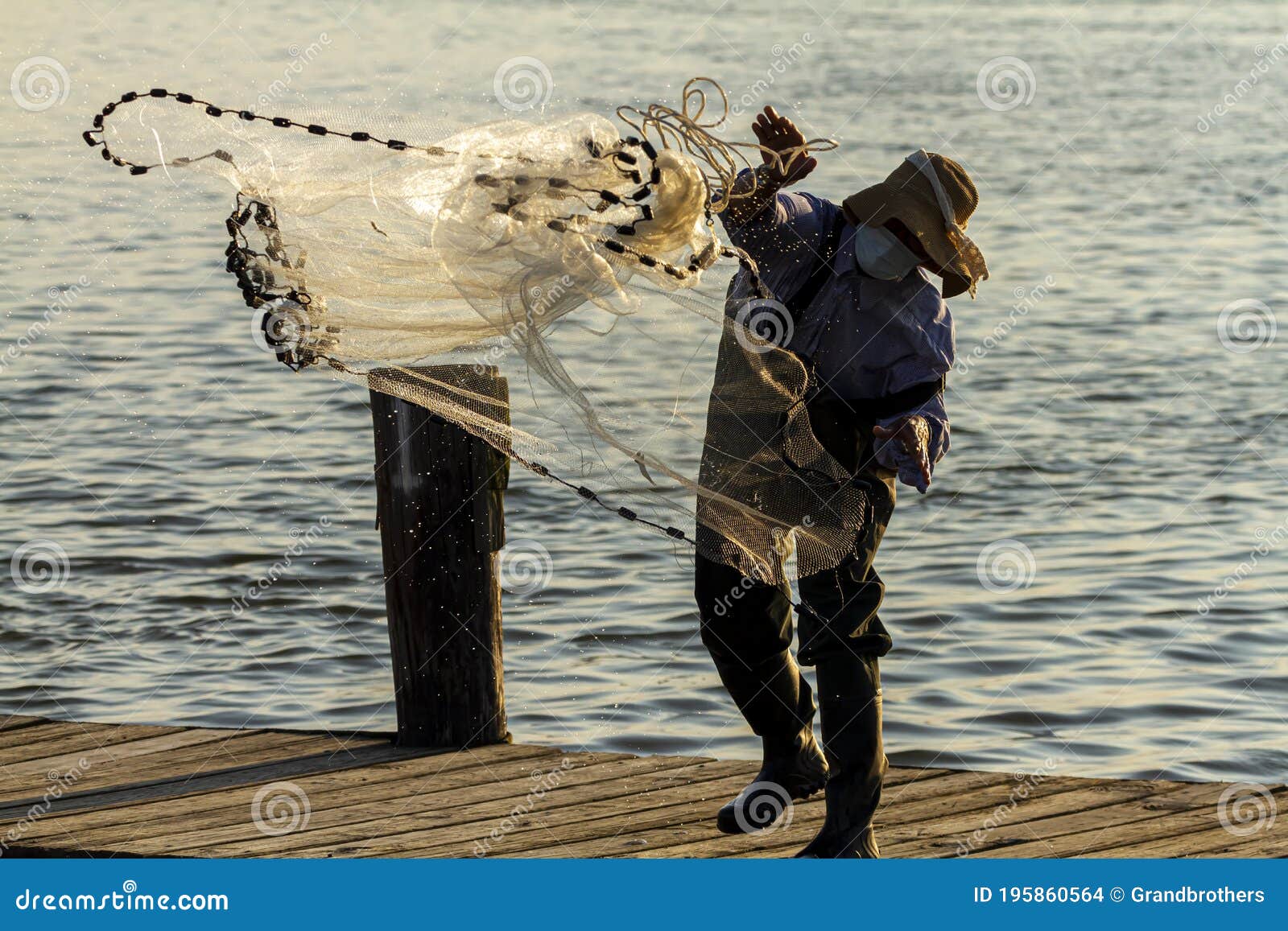 https://thumbs.dreamstime.com/z/fisherman-wearing-face-mask-casting-fishing-net-fisherman-wearing-overalls-boots-as-well-as-bucket-hat-throwing-195860564.jpg