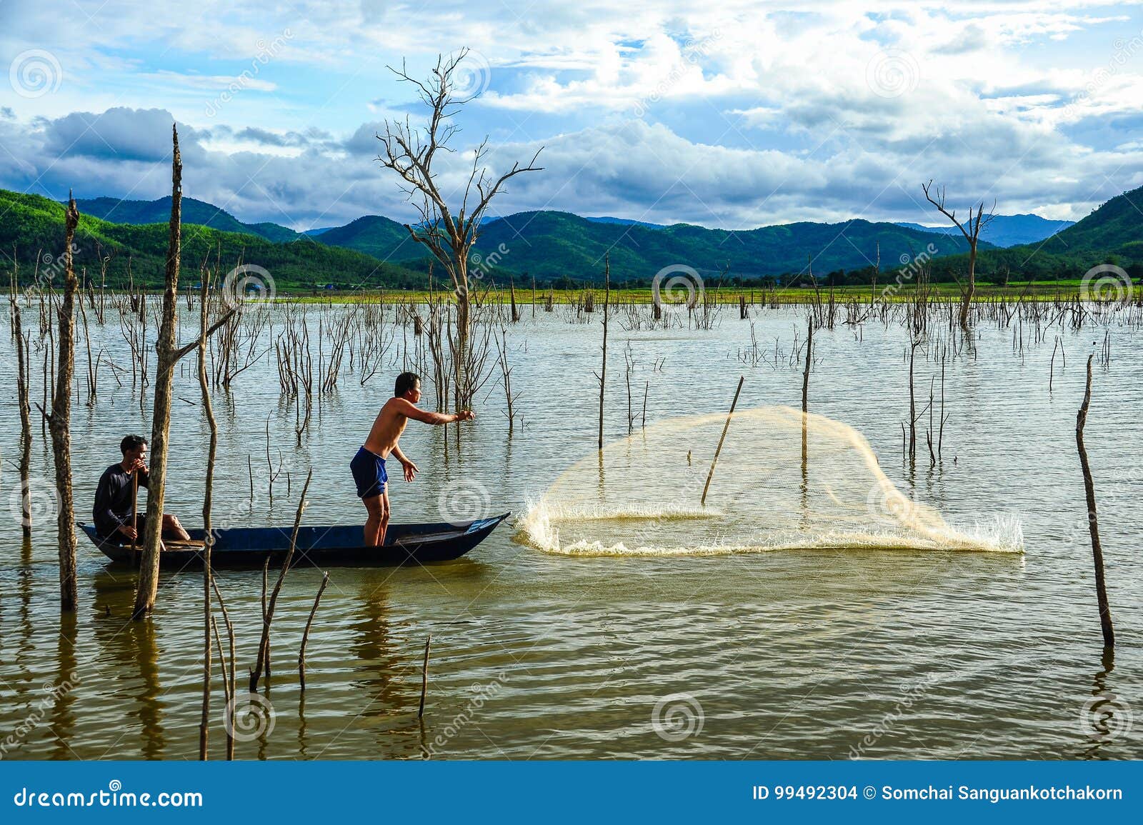 Fishermen on Boat Casting Fishing Net To Catch Fish in Swamp Editorial  Stock Image - Image of people, cloud: 99492304