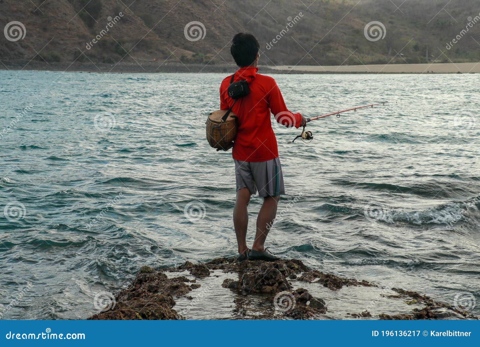 Fishermen Catch Fish at Low Tide. View from the Back of Guy with Fishing  Rods in the Water Stock Image - Image of nature, calmness: 196136217