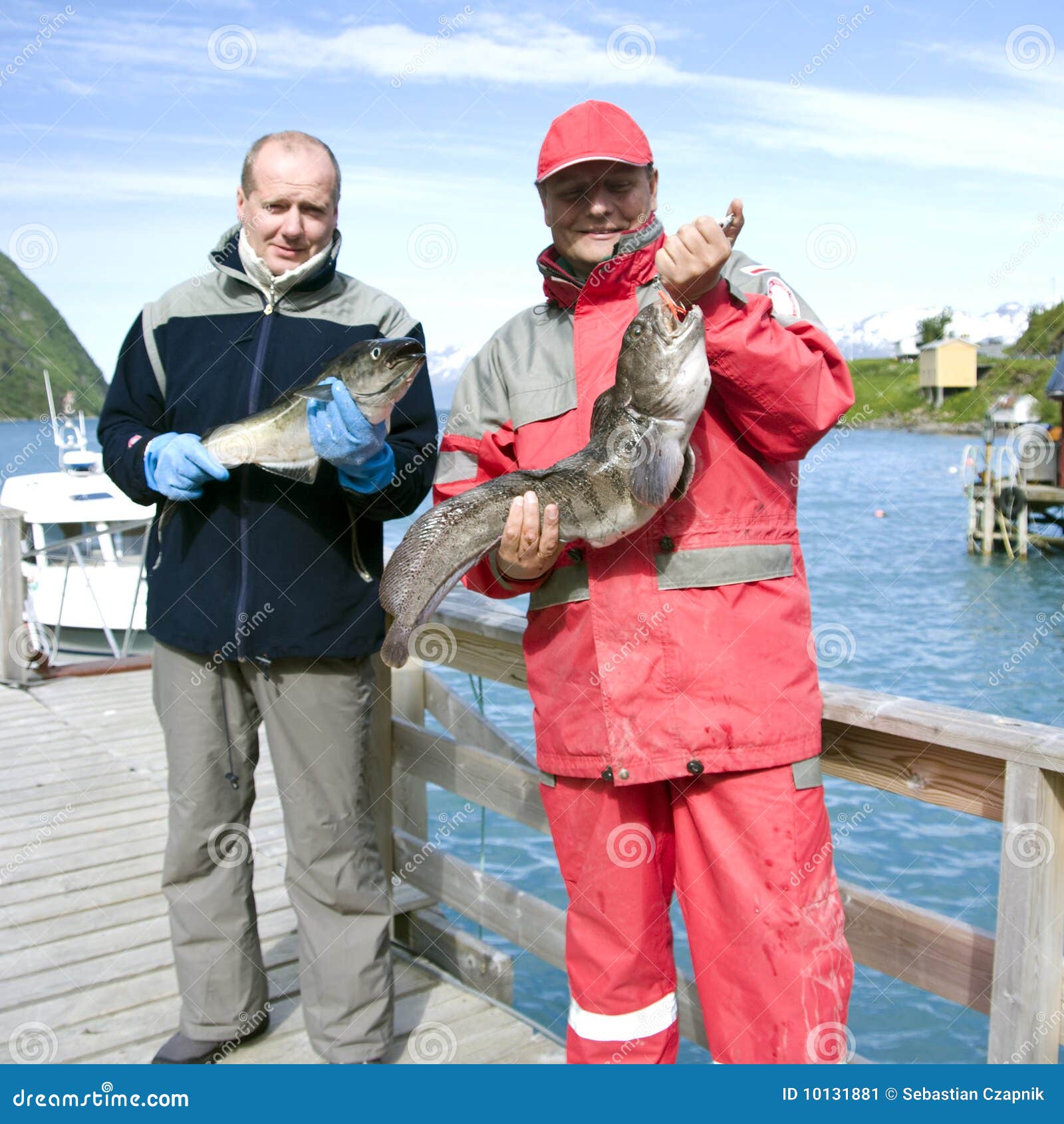 fishermen holding fish