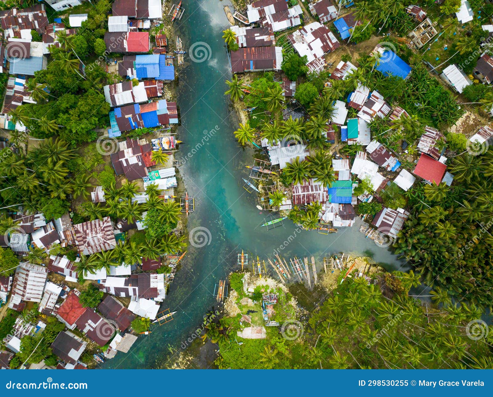fishermen houses and cold spring in surigao del sur. philippines.