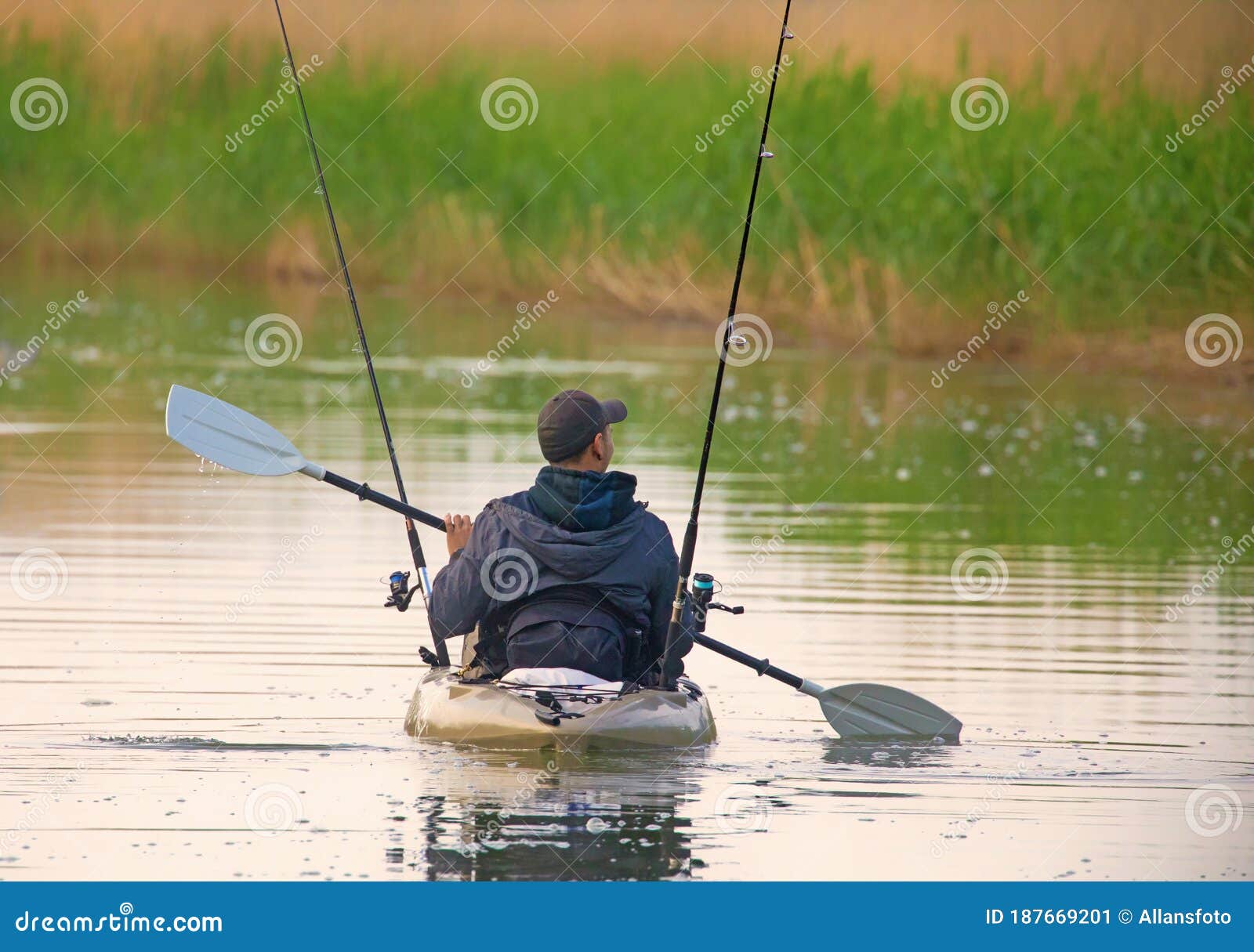 Fishermen Paddle in a Small Canoe, with Their Fishing Rods Ready To Fish  Editorial Photo - Image of fishing, canoeing: 187669201