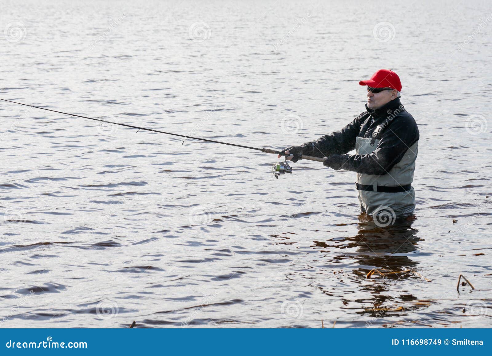 Fishermen Spin Fishing Using Chest Waders Stock Image - Image of