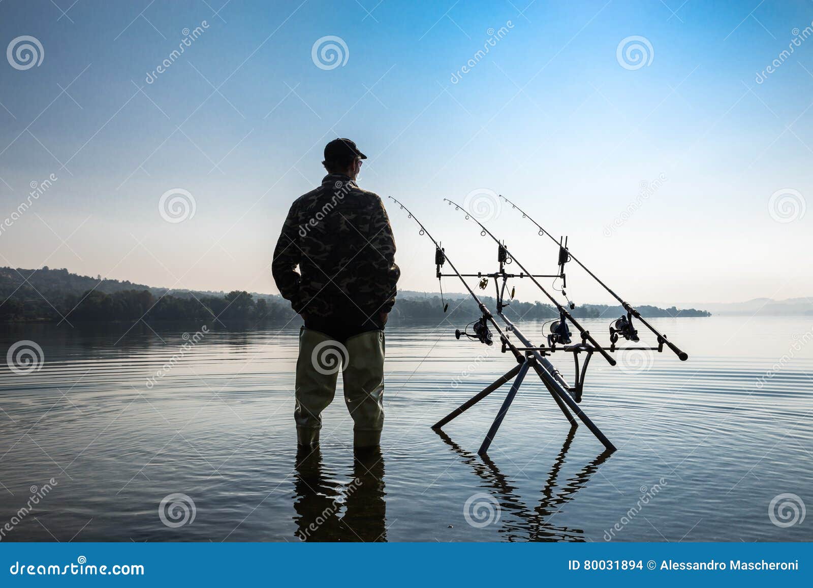 Fishing Adventures. Fisherman Waiting To Catch a Fish with Carp