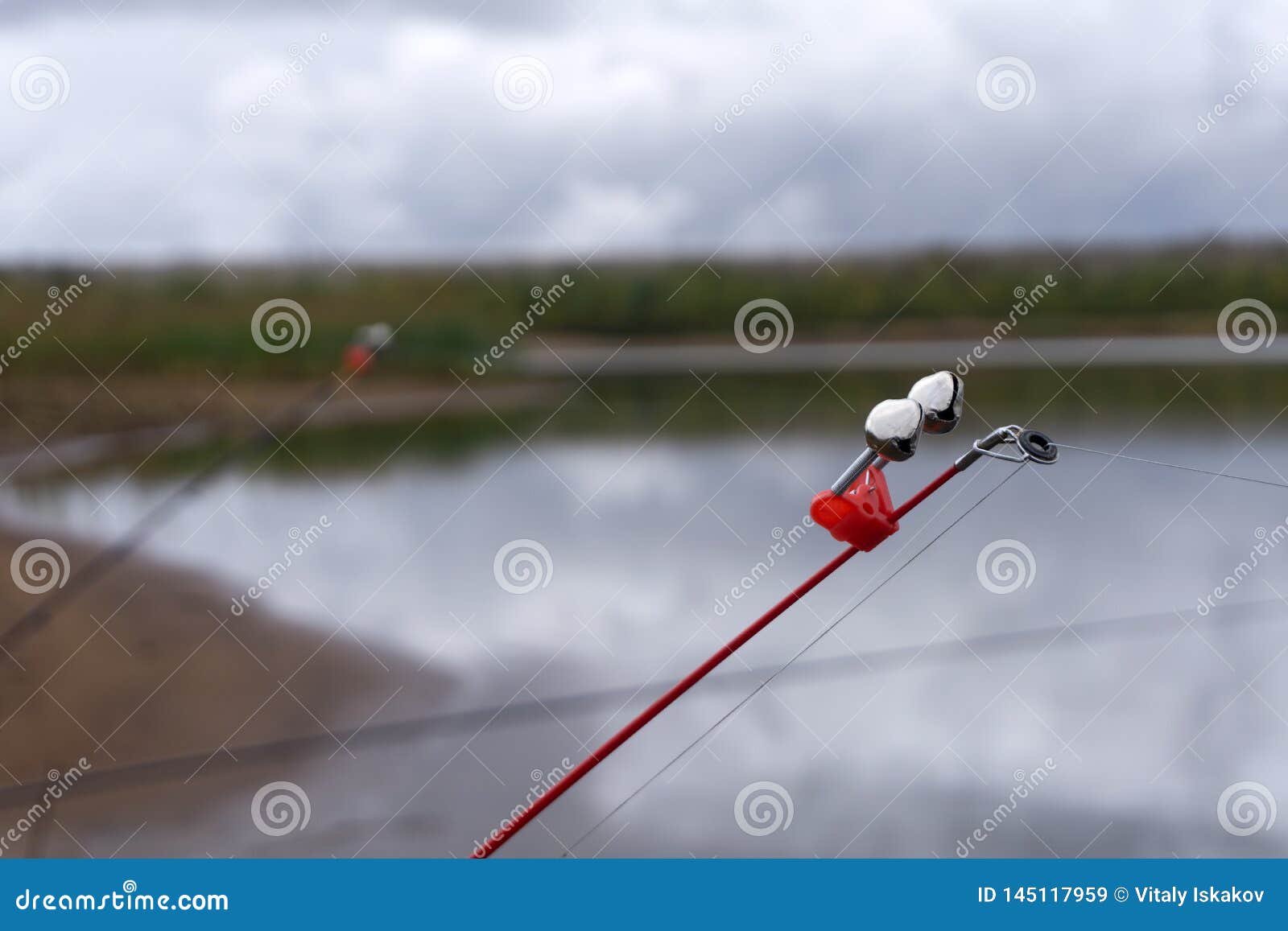 Fishing Bell at the End of a Fishing Rod. Bells Will Ring when the Fish