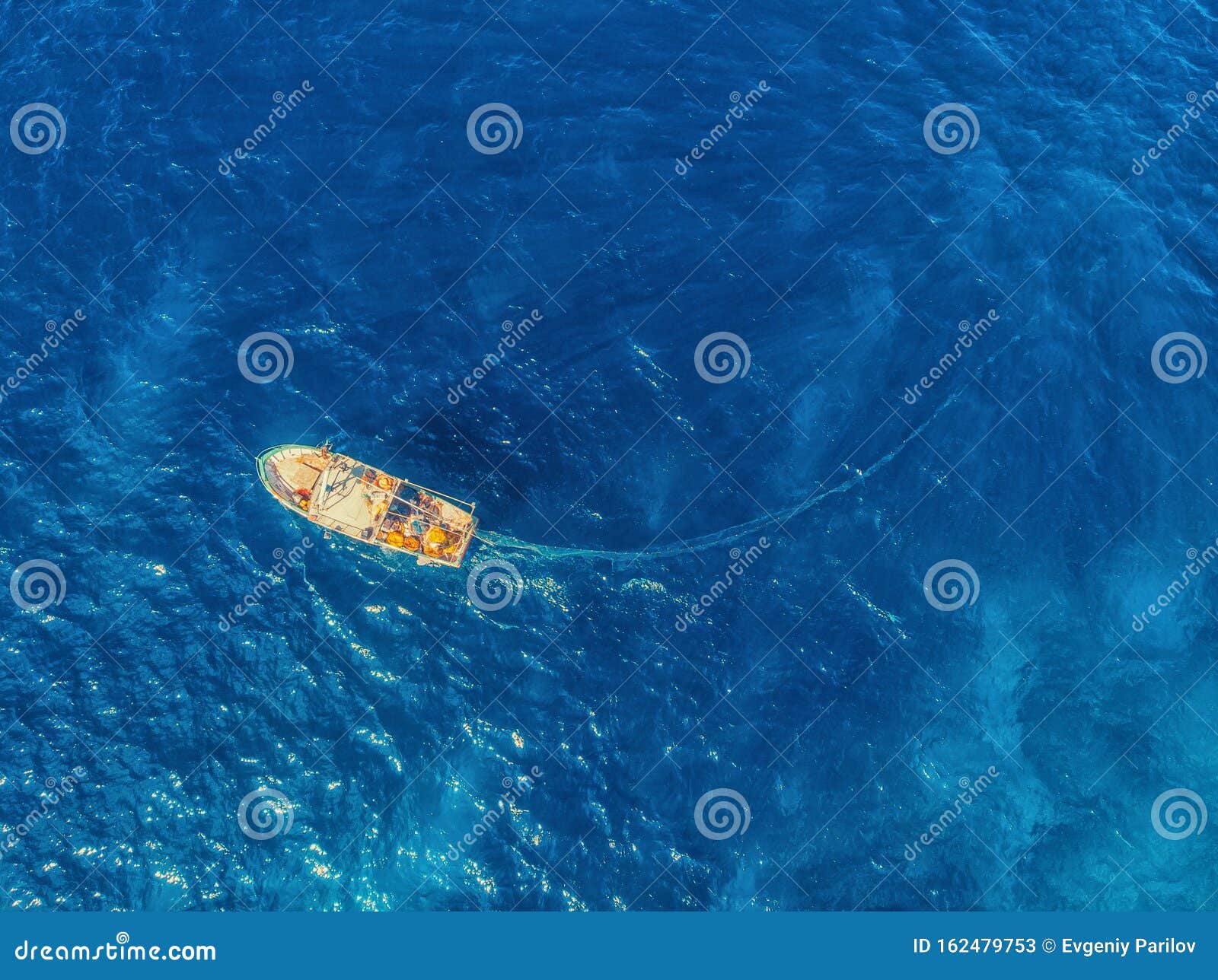 Fishing Boat in Blue Sea Water, Fishermen Set Nets for Fish