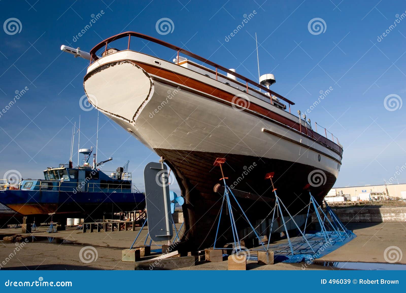 Royalty-Free photo: Red Blue and White Fishing Boats on Dock during Daytime