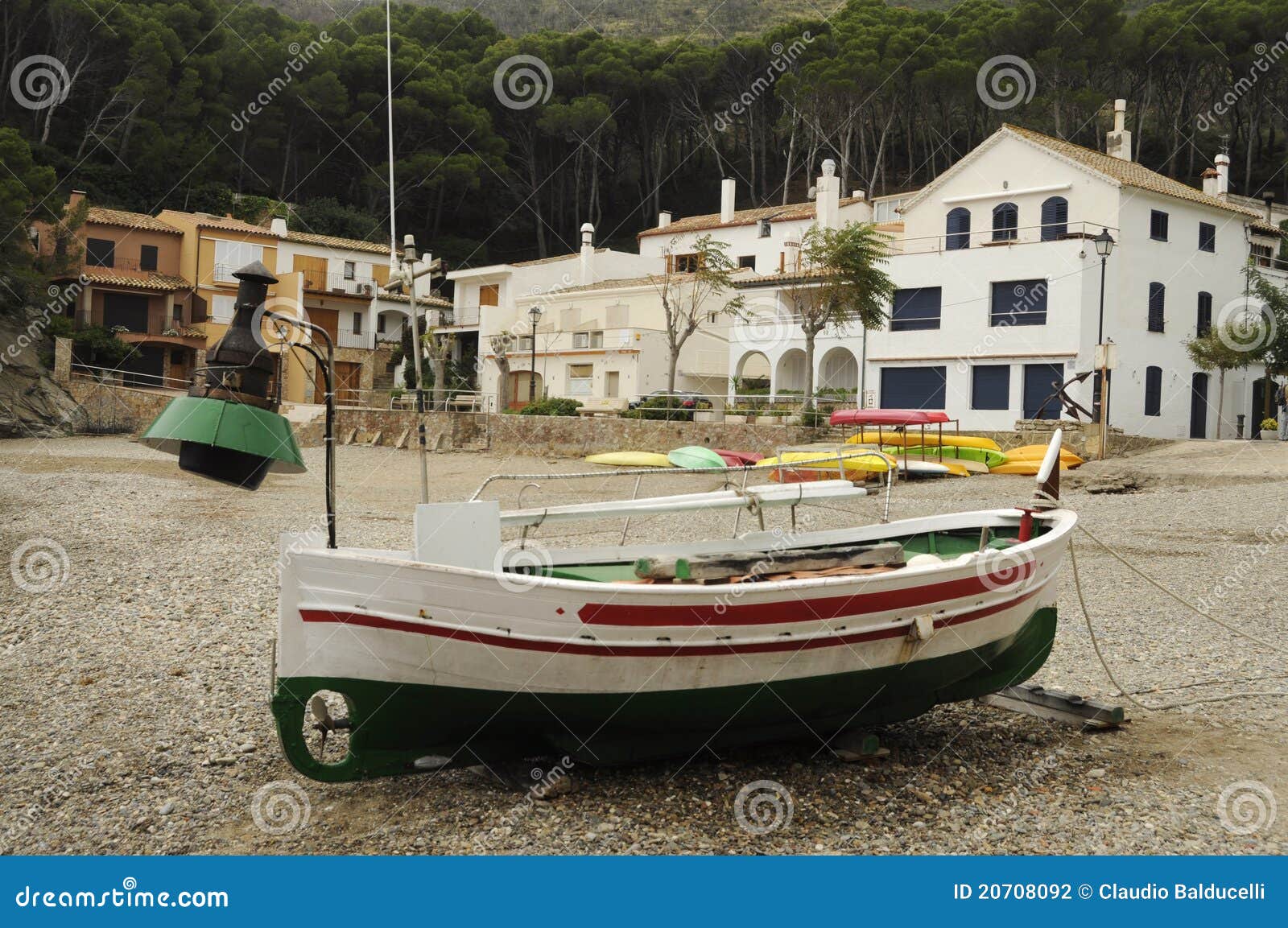 fishing boat with lamp on the beach