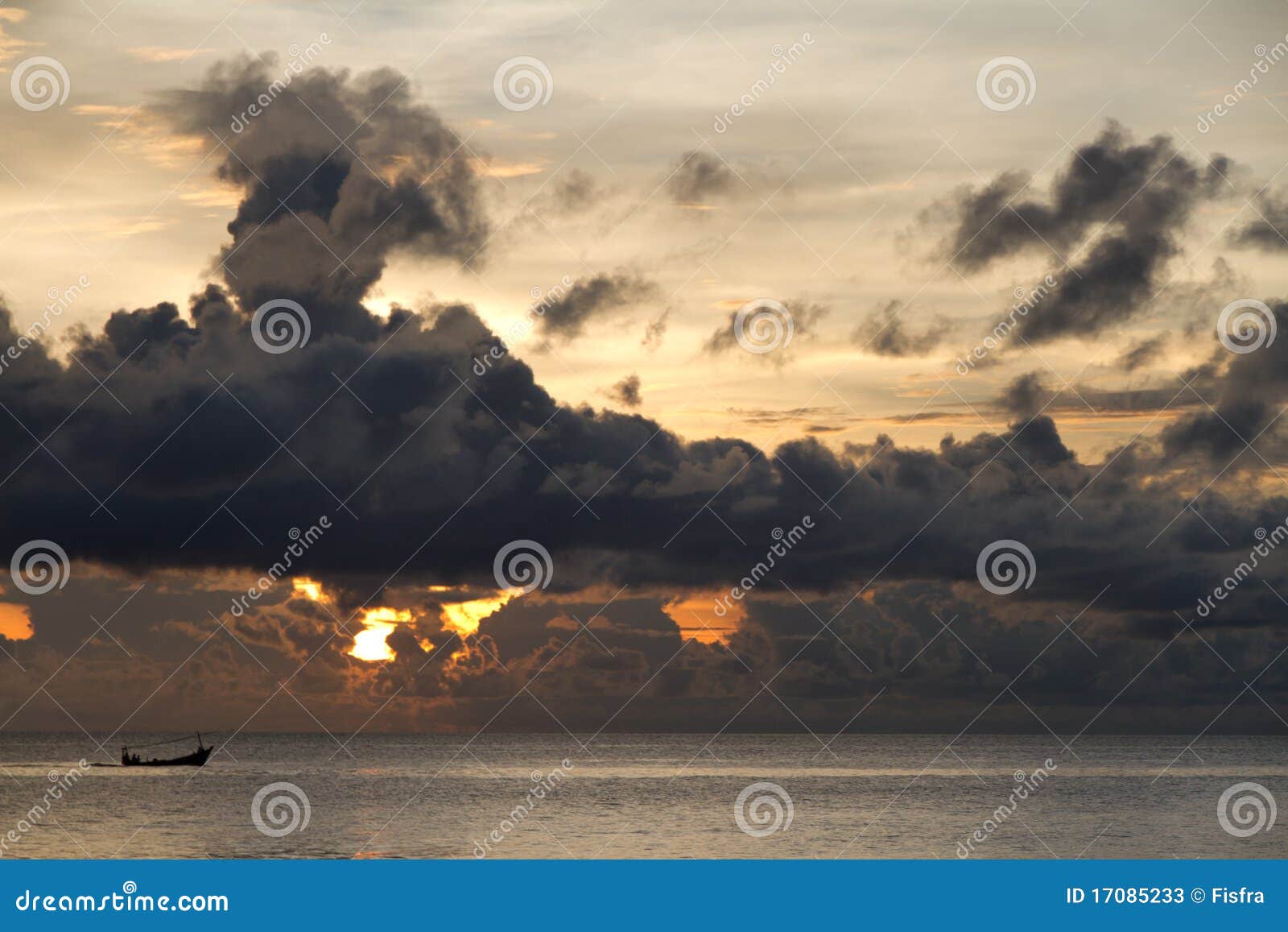 fishing boat with threatening clouds