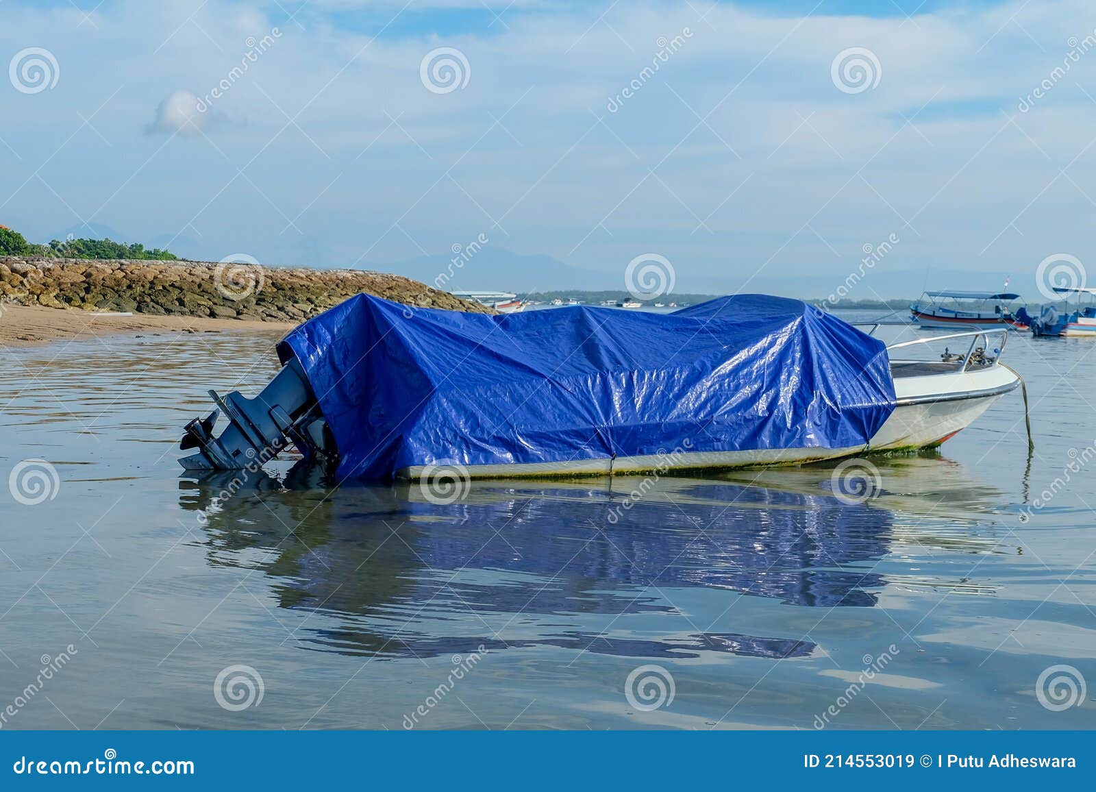 Fishing Boat Wrapped in Blue Plastic Cloth. Stock Image - Image of