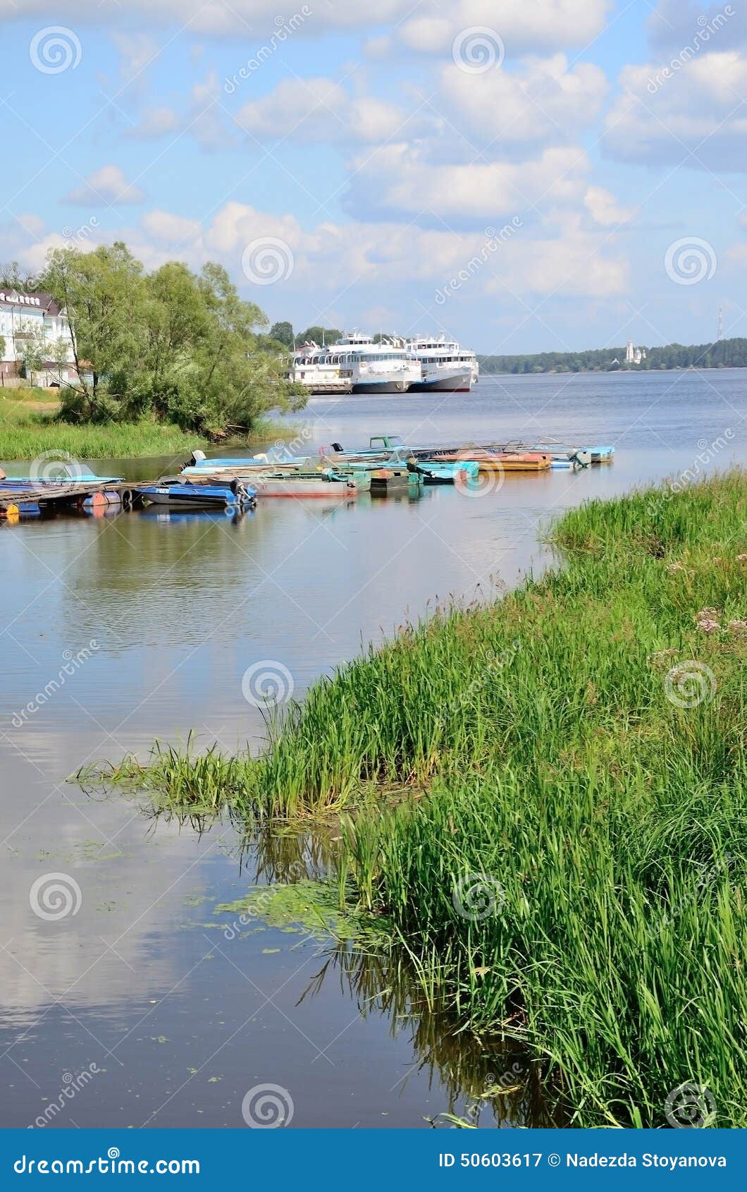 fishing boats and motor ships in volga river in summer, russia.