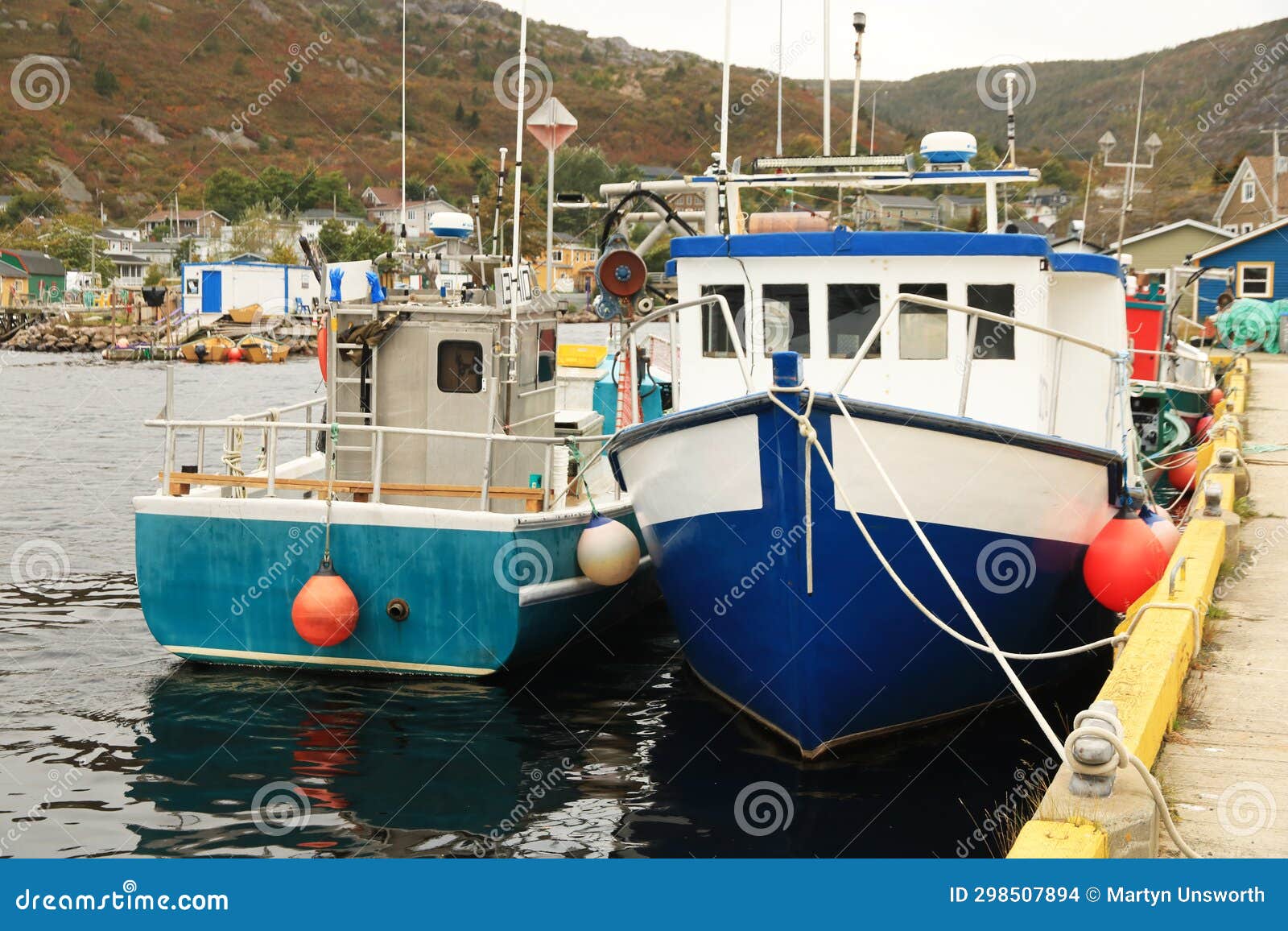 https://thumbs.dreamstime.com/z/fishing-boats-tied-to-jetty-petty-harbor-newfoundland-community-located-canadian-province-labrador-dock-298507894.jpg