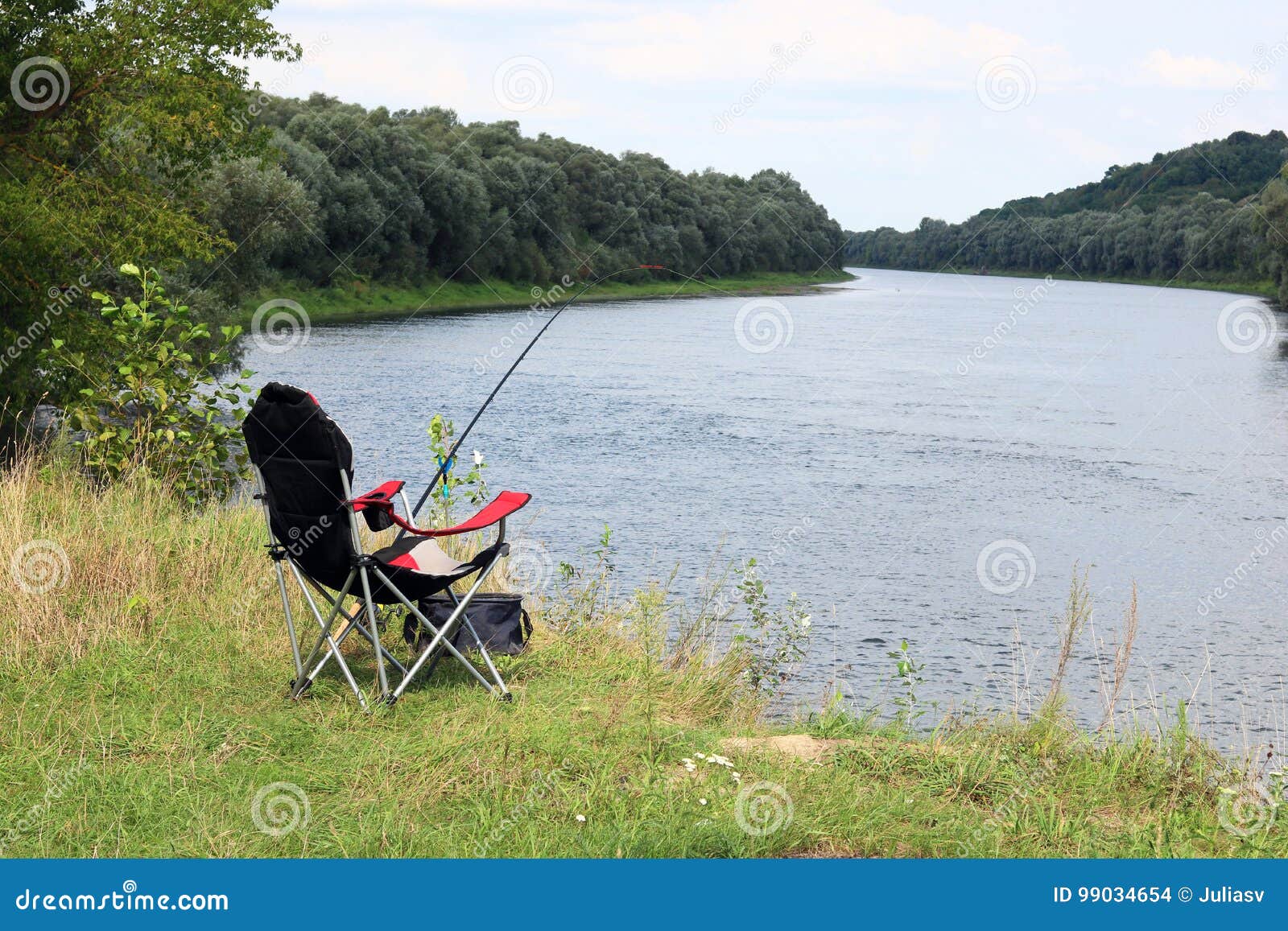 Fishing Chair, Rod and Bait on the River Bank Stock Photo - Image