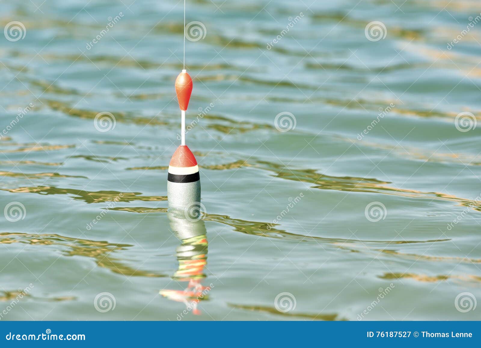 https://thumbs.dreamstime.com/z/fishing-cork-floating-water-surface-76187527.jpg