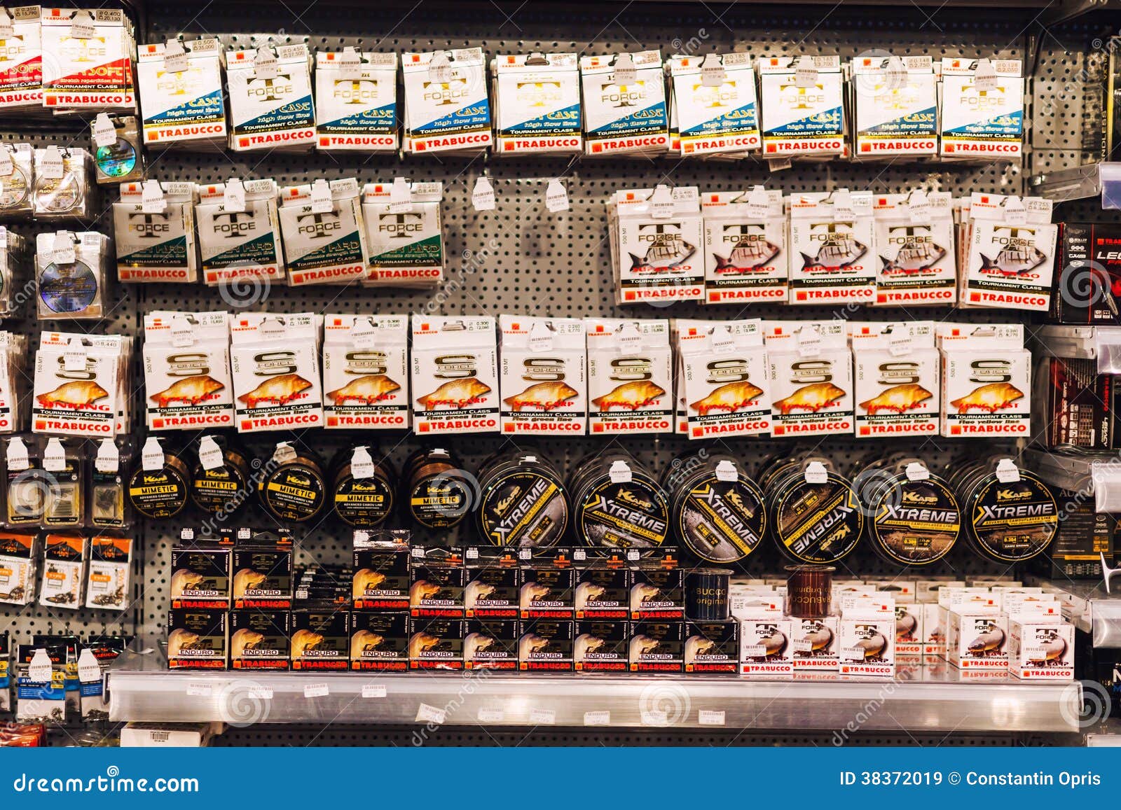 Fishing equipment in shop editorial stock image. Image of reels 38372019