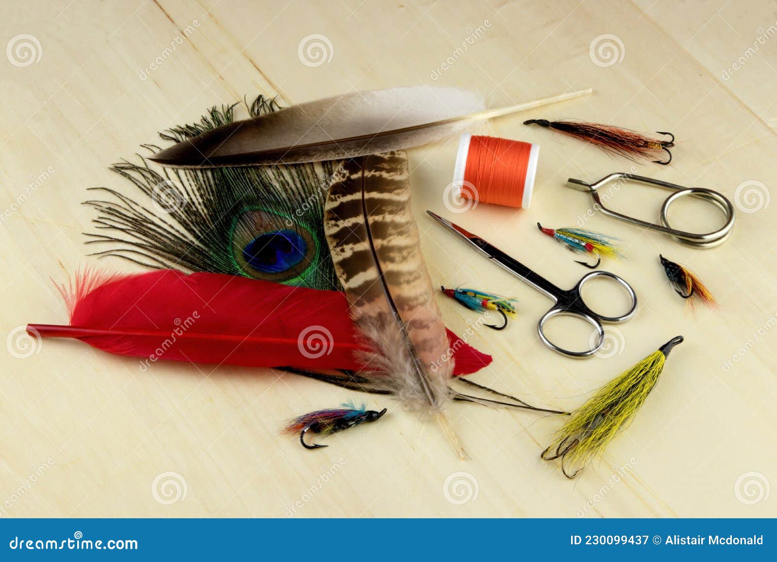 Fishing Fly Tying Materials and Tools on a Wooden Surface Stock Image