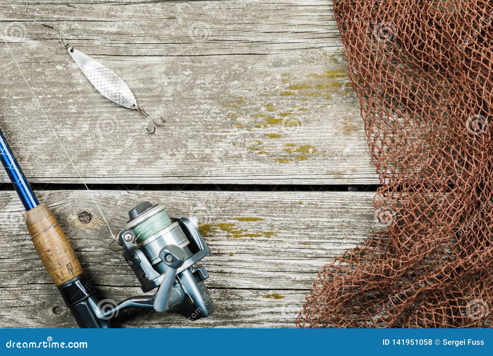 Fishing Gear, Hooks and Baits on a Wooden Background Stock Photo