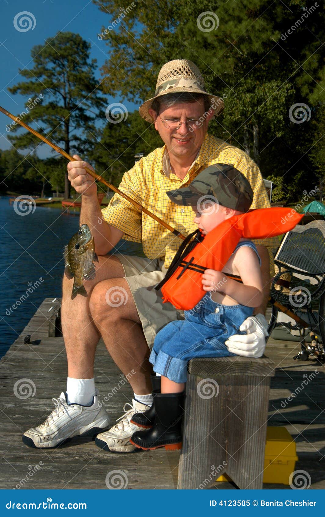 Fishing with Grandpa stock image. Image of blue, childhood - 4123505
