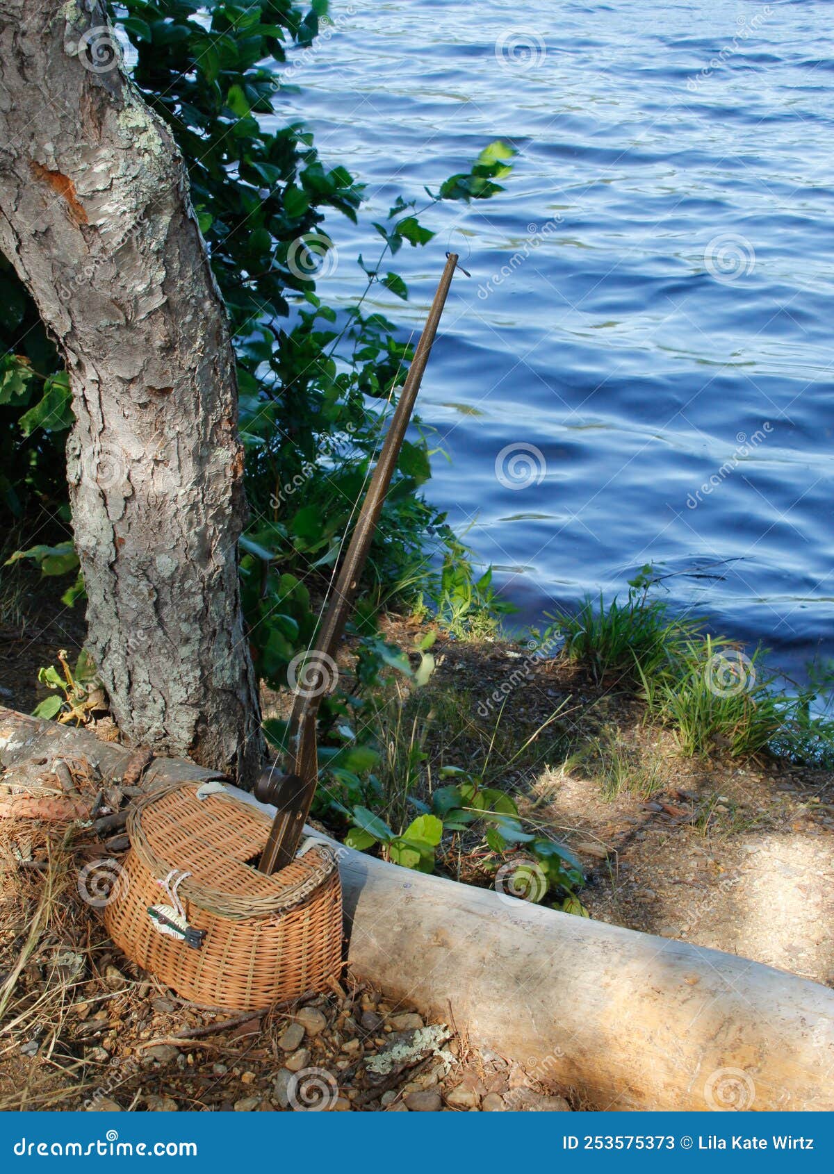 Fishing Hole- Antique Wooden Fishing Pole and Small Wicker Basket for  Fishing Lures Stock Image - Image of plain, fishing: 253575373