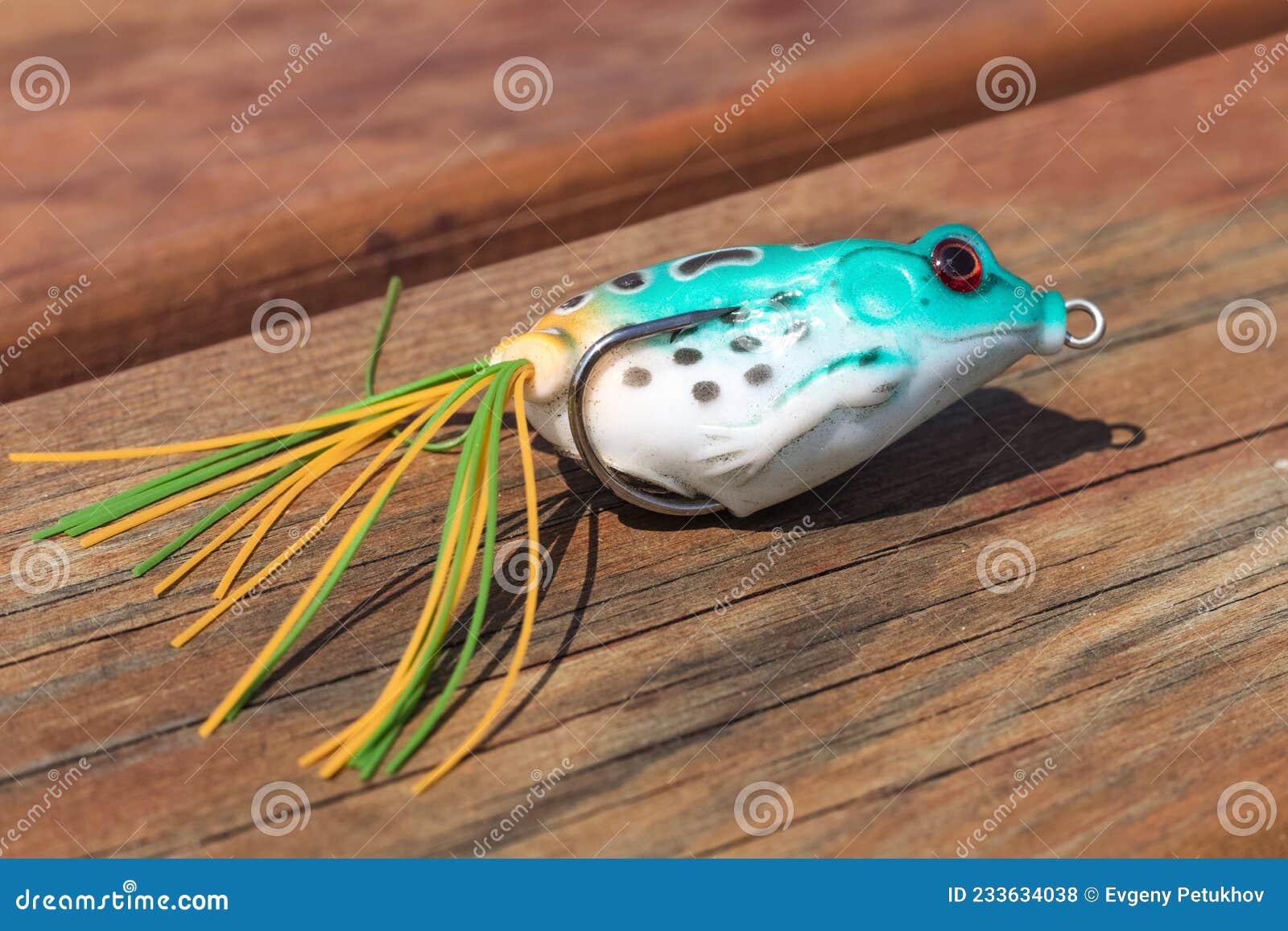 Fishing Hook with a Bayman in the Shape of a Frog. Fishing Bait on Green  Cloth Background. Stock Photo - Image of hobbies, catch: 233634038