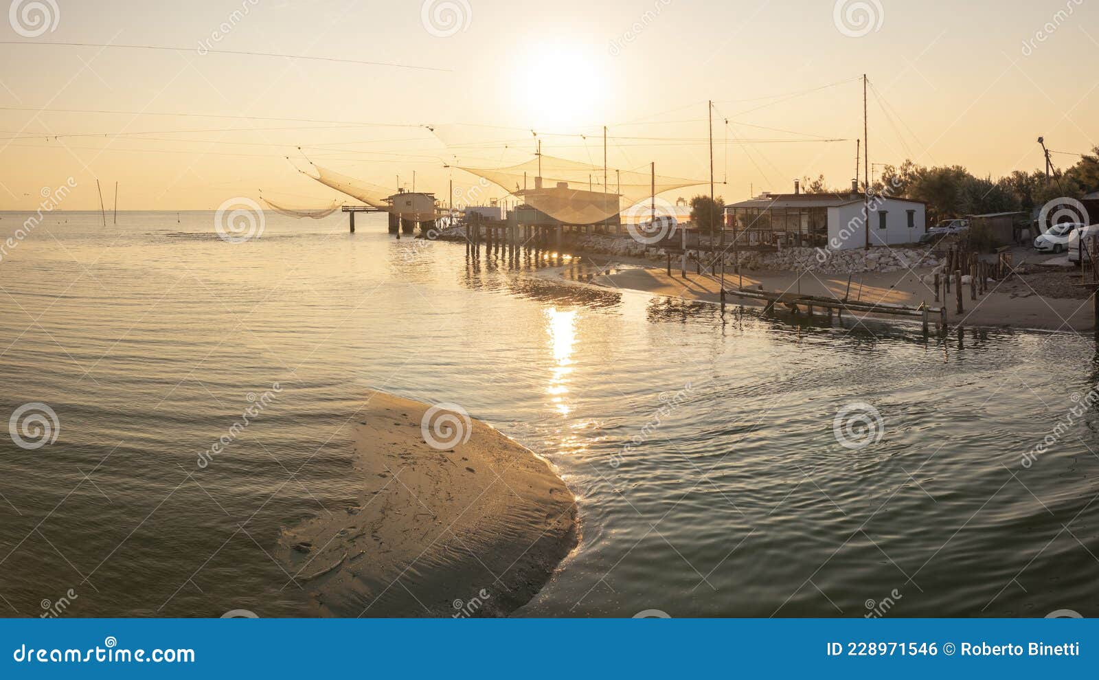 fishing huts in adriatic coast at sunrise