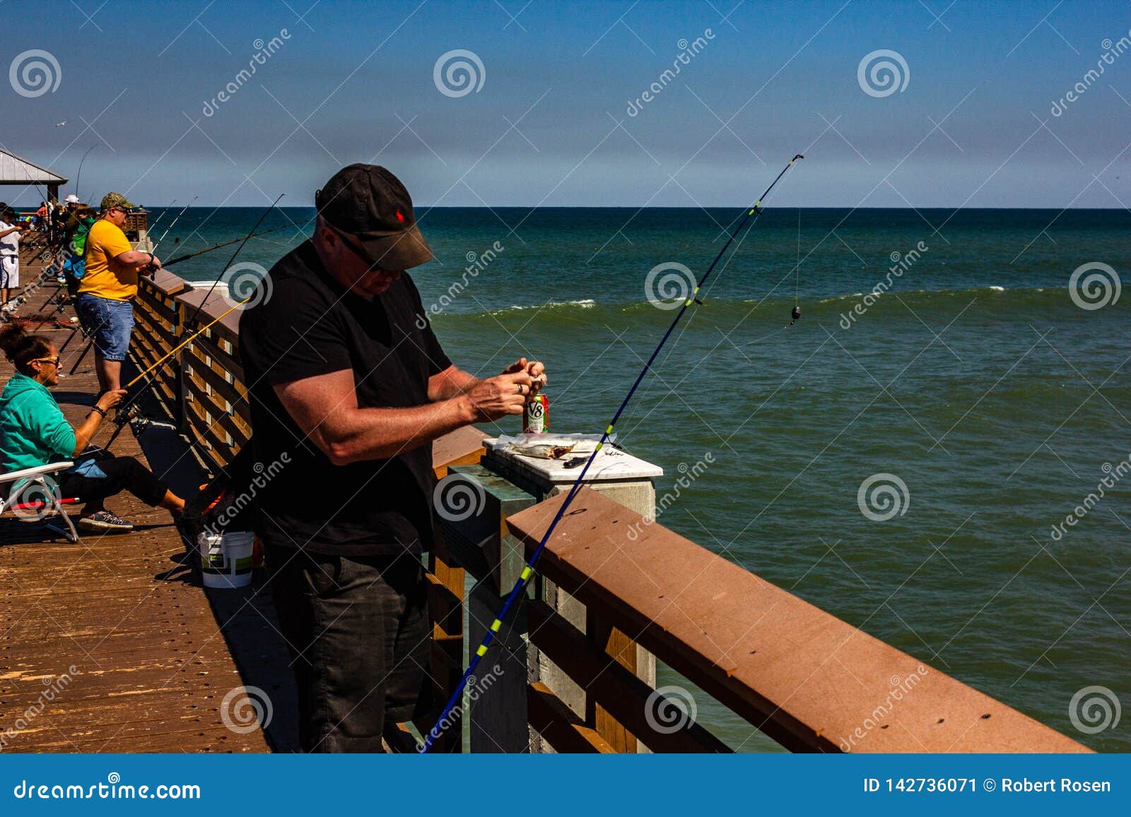 Cleaning the daily Catch editorial photo. Image of beach 142736071