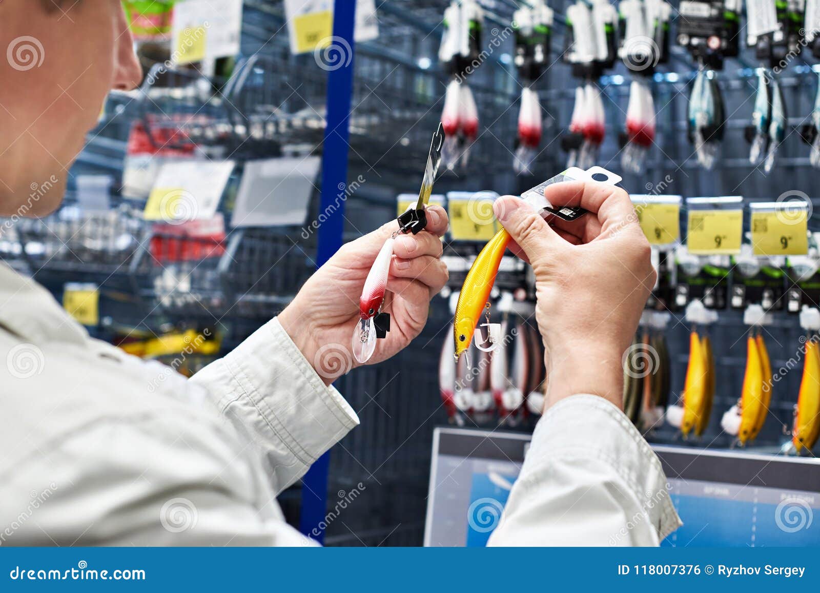 Fishing Lure Baits in Hands Man in Store Stock Photo Image of taking