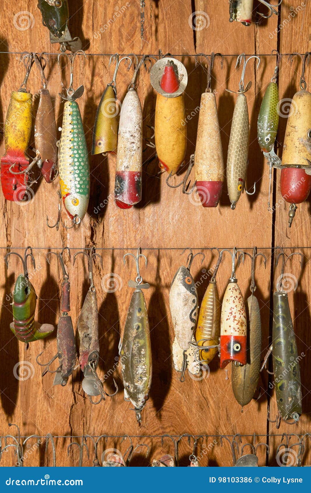 Fishing Lures Hanging Against Wall Stock Photo - Image of angling