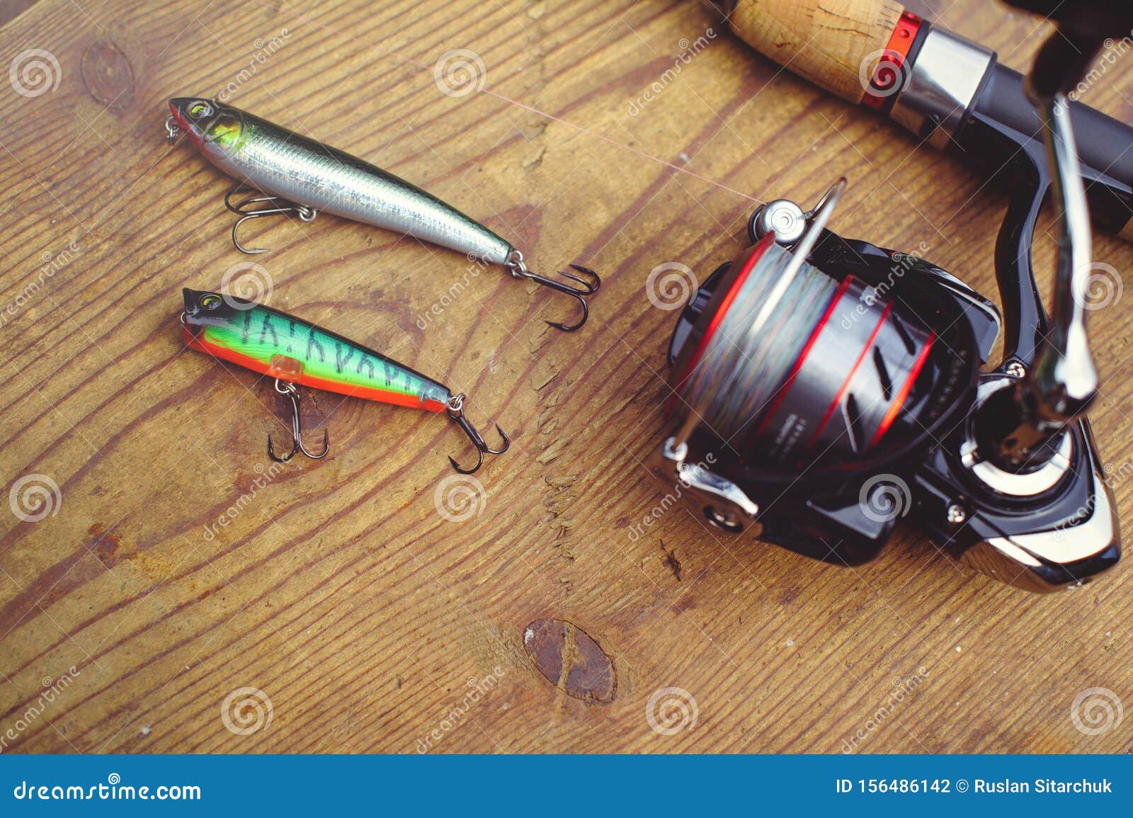 Fishing Lures with Large Hooks, Plastic Fishing Lures Fishing Tackle.  Jelly. Wobbler on a Background of Wood with Two Hooks Stock Photo - Image  of gear, angling: 156486142