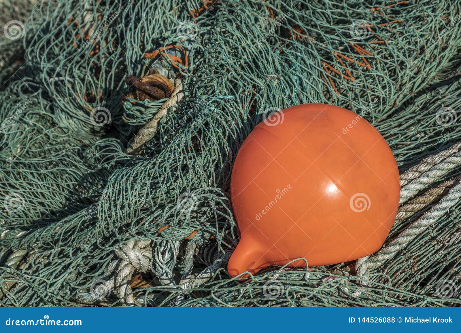 Fishing net with a buoy stock photo. Image of color - 144526088