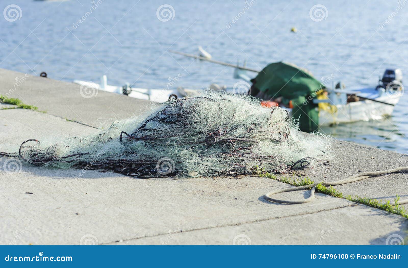 Fishing net at Pier stock photo. Image of nautical, industrial 74796100