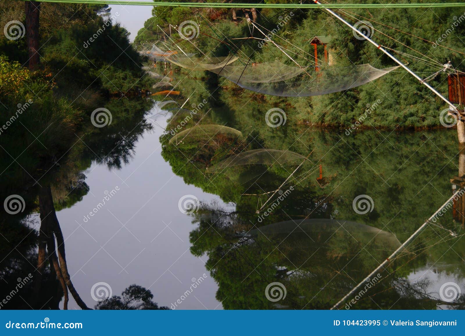 Fishing nets on the river stock image. Image of bank 104423995
