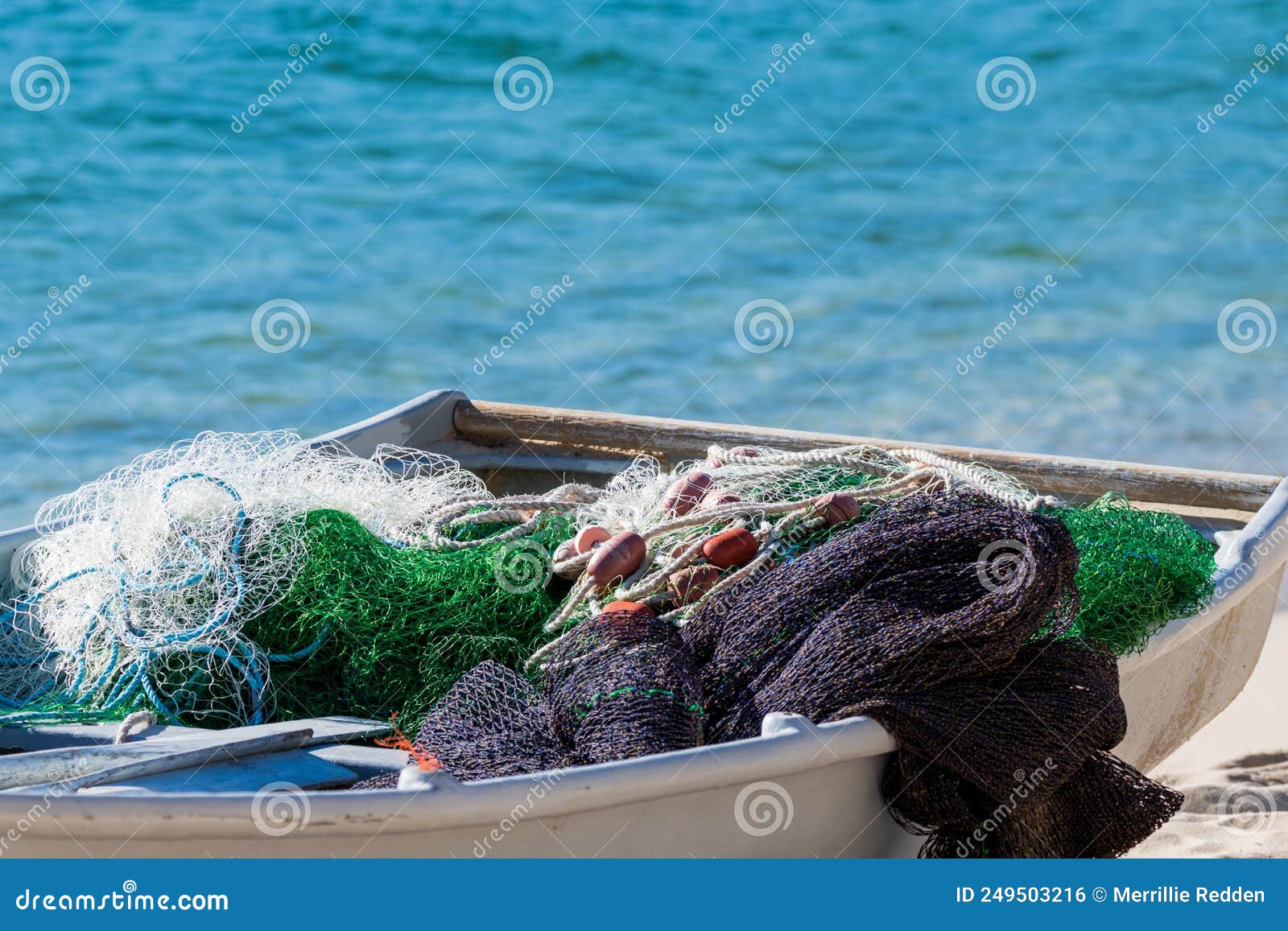 Fishing Nets in a Tin Boat on the Shore Stock Photo - Image of