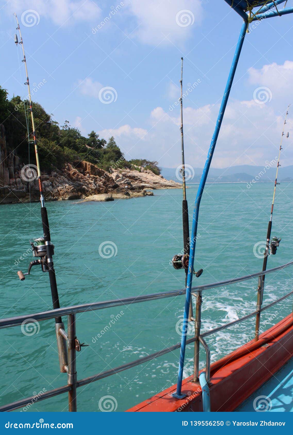 Fishing in the Pacific Ocean on a Boat with Fishing Rods Stock