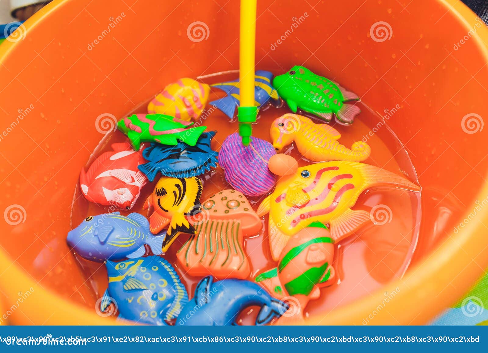 Fishing in the Paddling Pool. Children`s Toys in the Pool. Toy Fish Fishing  Rod Stock Photo - Image of beautiful, happiness: 168969144