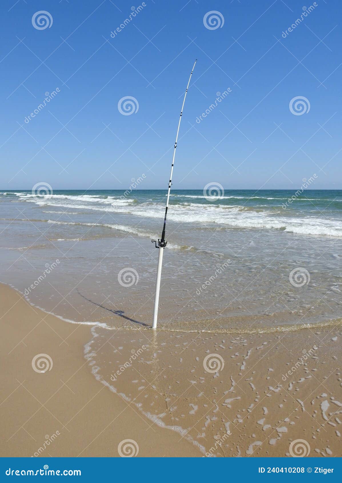 Fishing Pole on the Beach stock photo. Image of ocean - 240410208