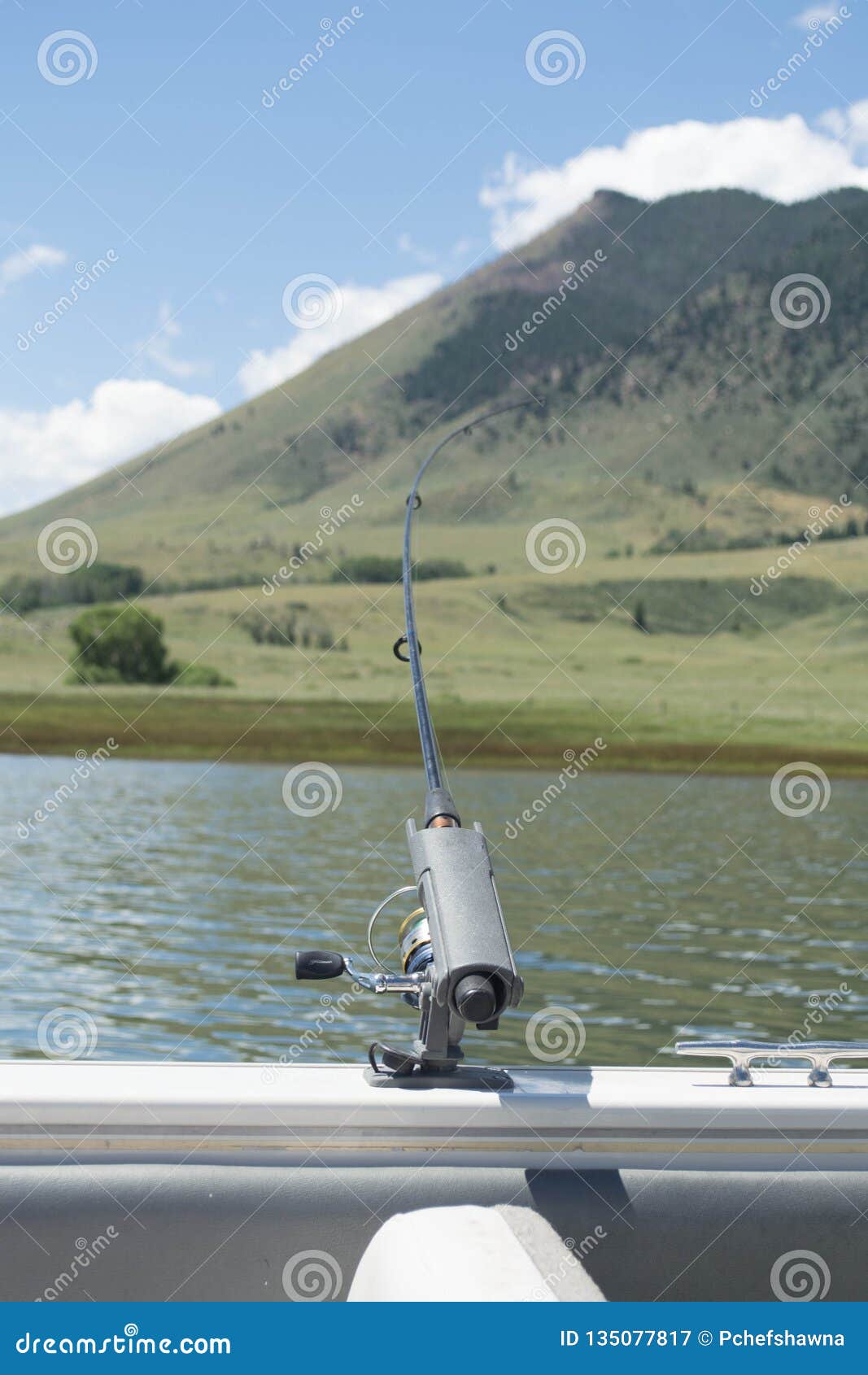 https://thumbs.dreamstime.com/z/fishing-pole-holder-boat-fishing-pole-holding-boat-slightly-bending-mountain-background-lake-135077817.jpg