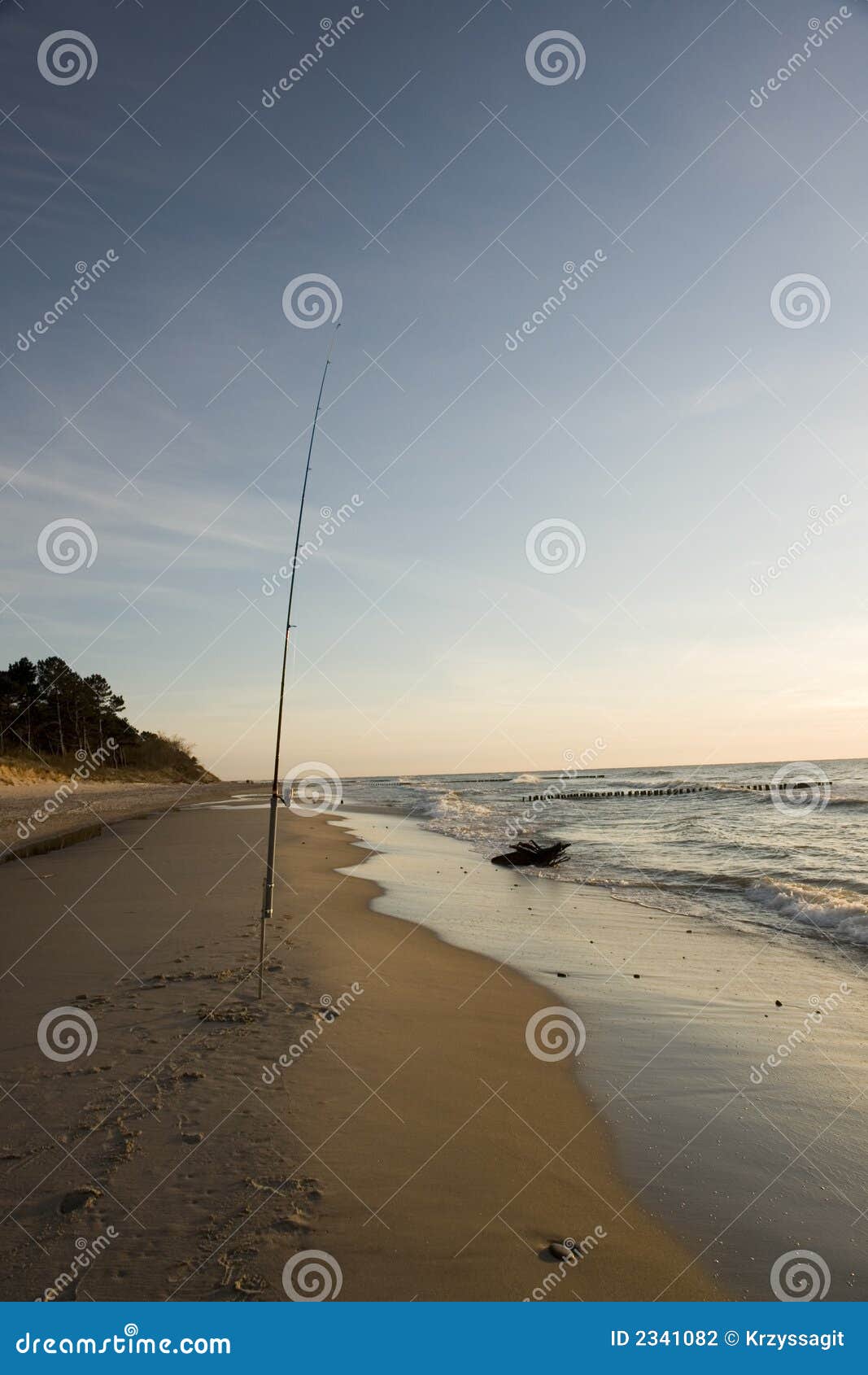 Fishing Pole in Sand on Beach Stock Photo - Image of serene, blue: 2341082