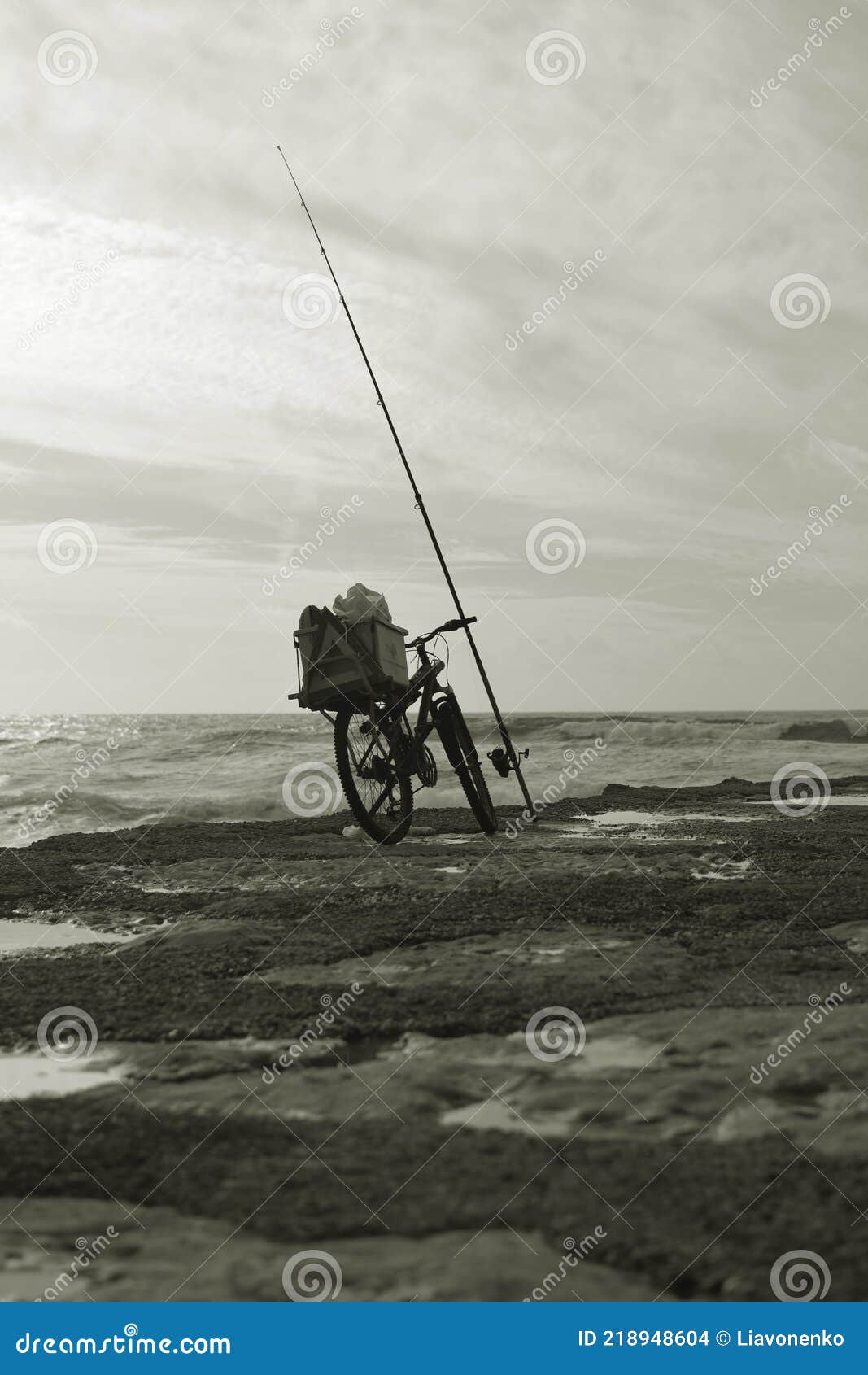 fishing in portugal. atlantic ocean beach. bicicleta. black and white photo scene. water sky clouds wonderful travel portugal