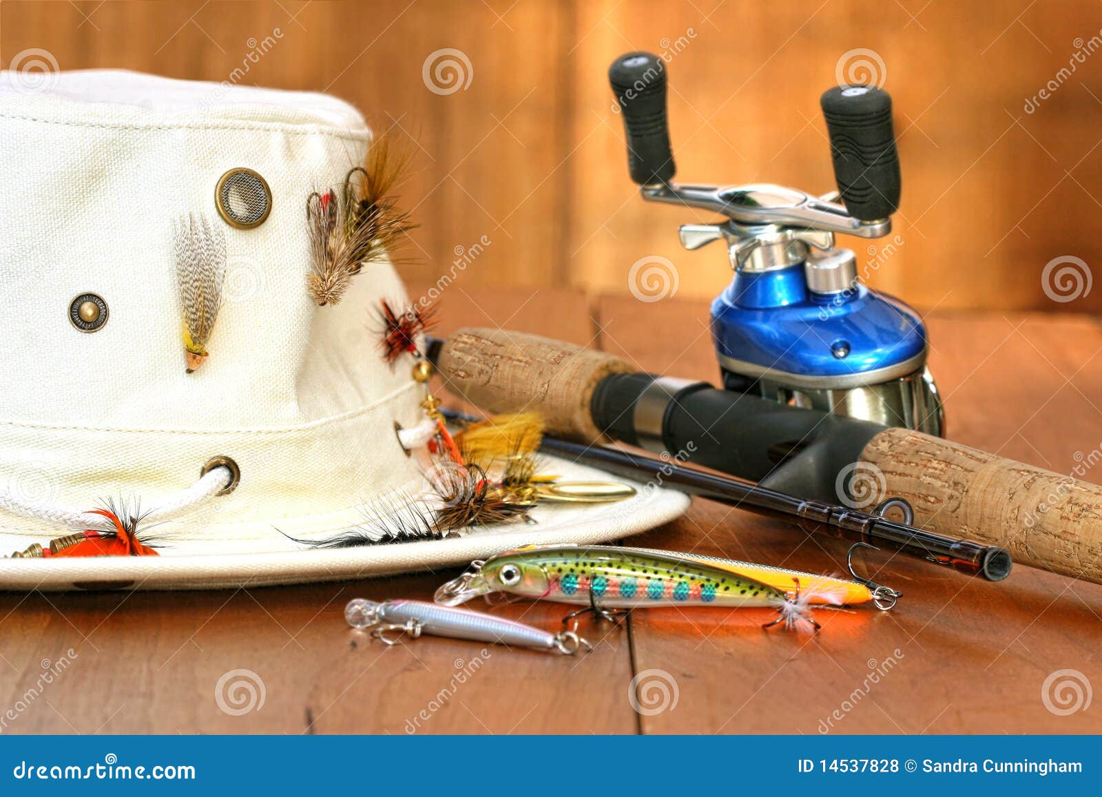Fishing Reel with Hat and Color Lures Stock Photo Image of river