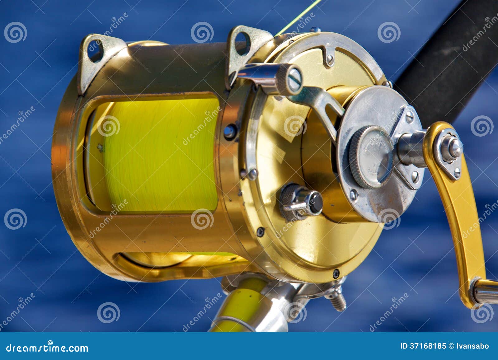 A Fishing Reel Set Against Blue Ocean Stock Image Image of fishing