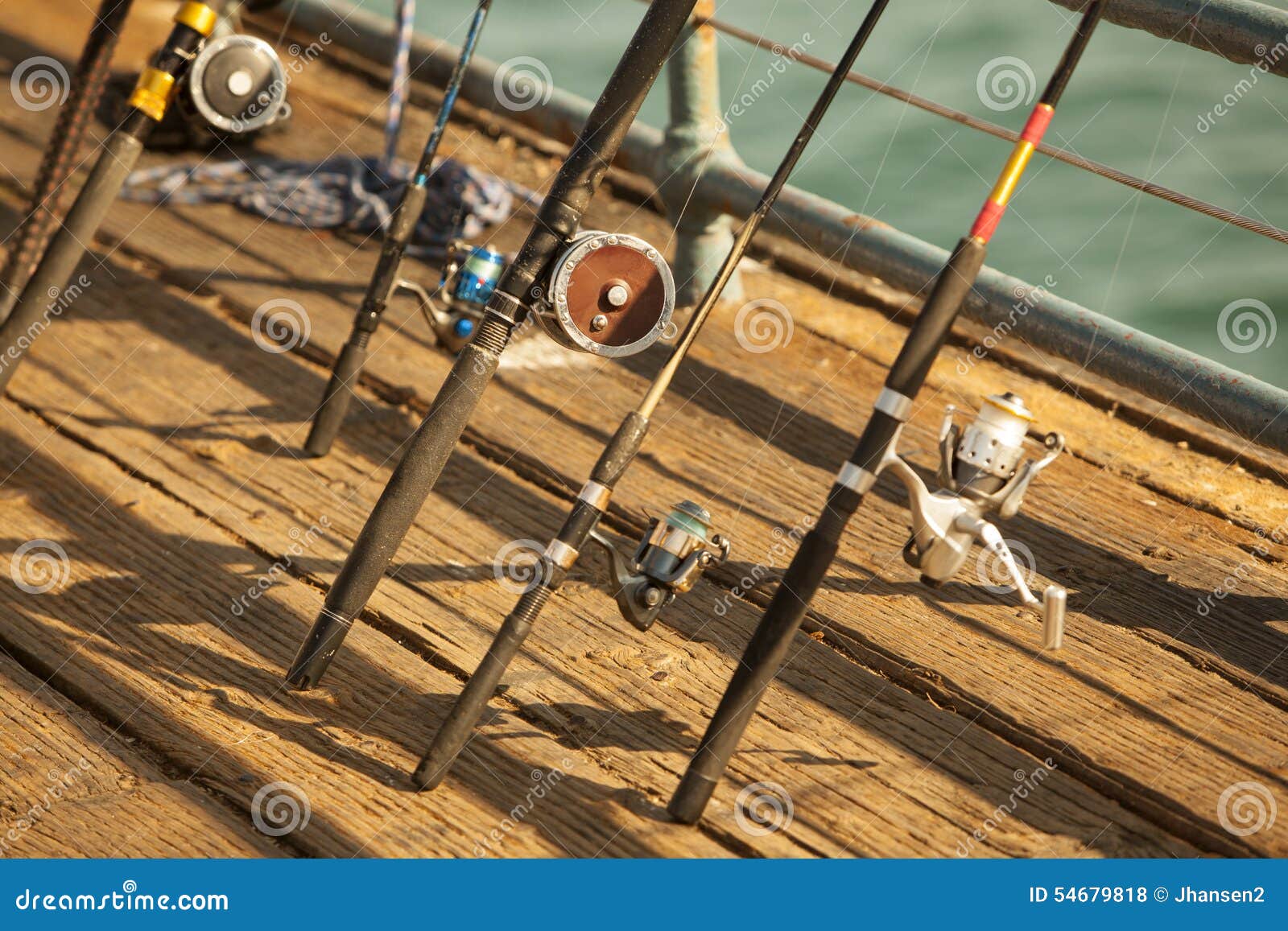 Fishing Reels on the Dock stock photo. Image of dock 54679818