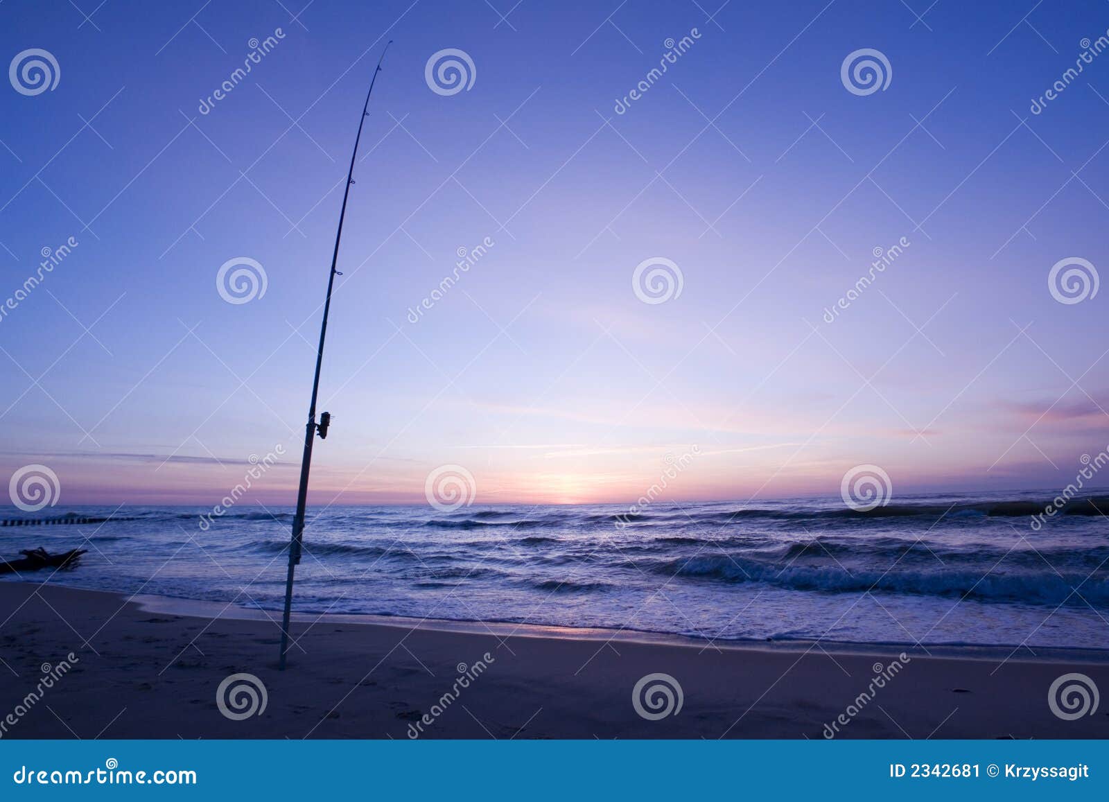 Fishing rod on the beach stock image. Image of serene 2342681