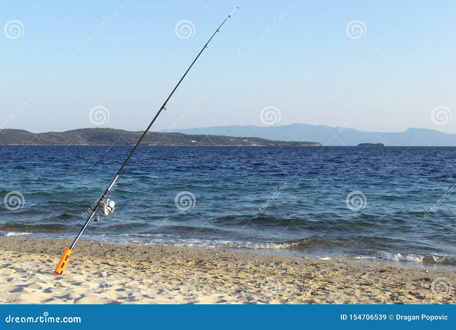 Fishing rod on beach shore stock image. Image of nature 154706539