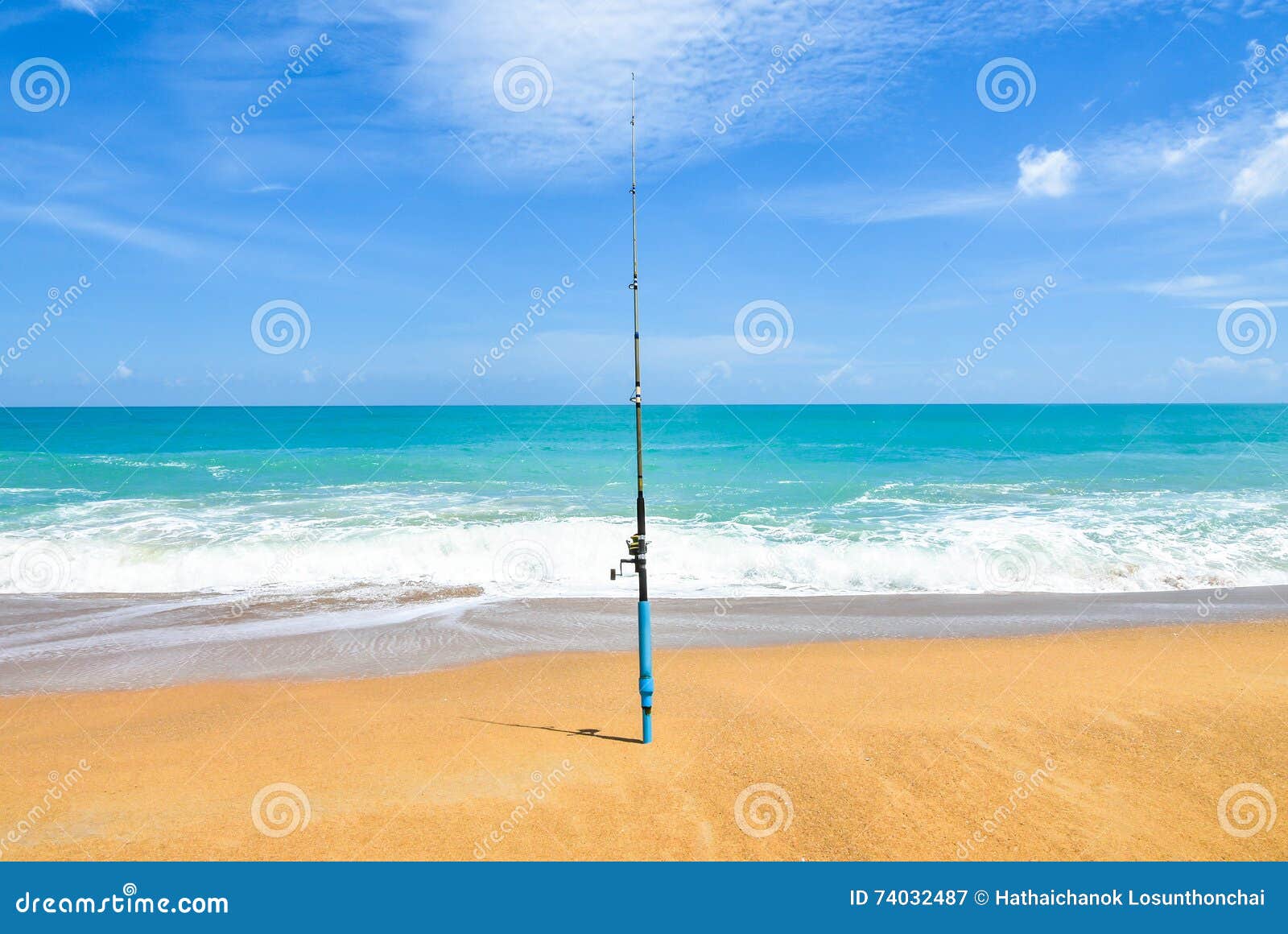 Fishing Rod on Empty Beach with Beautiful Ocean. Rod Spinning with