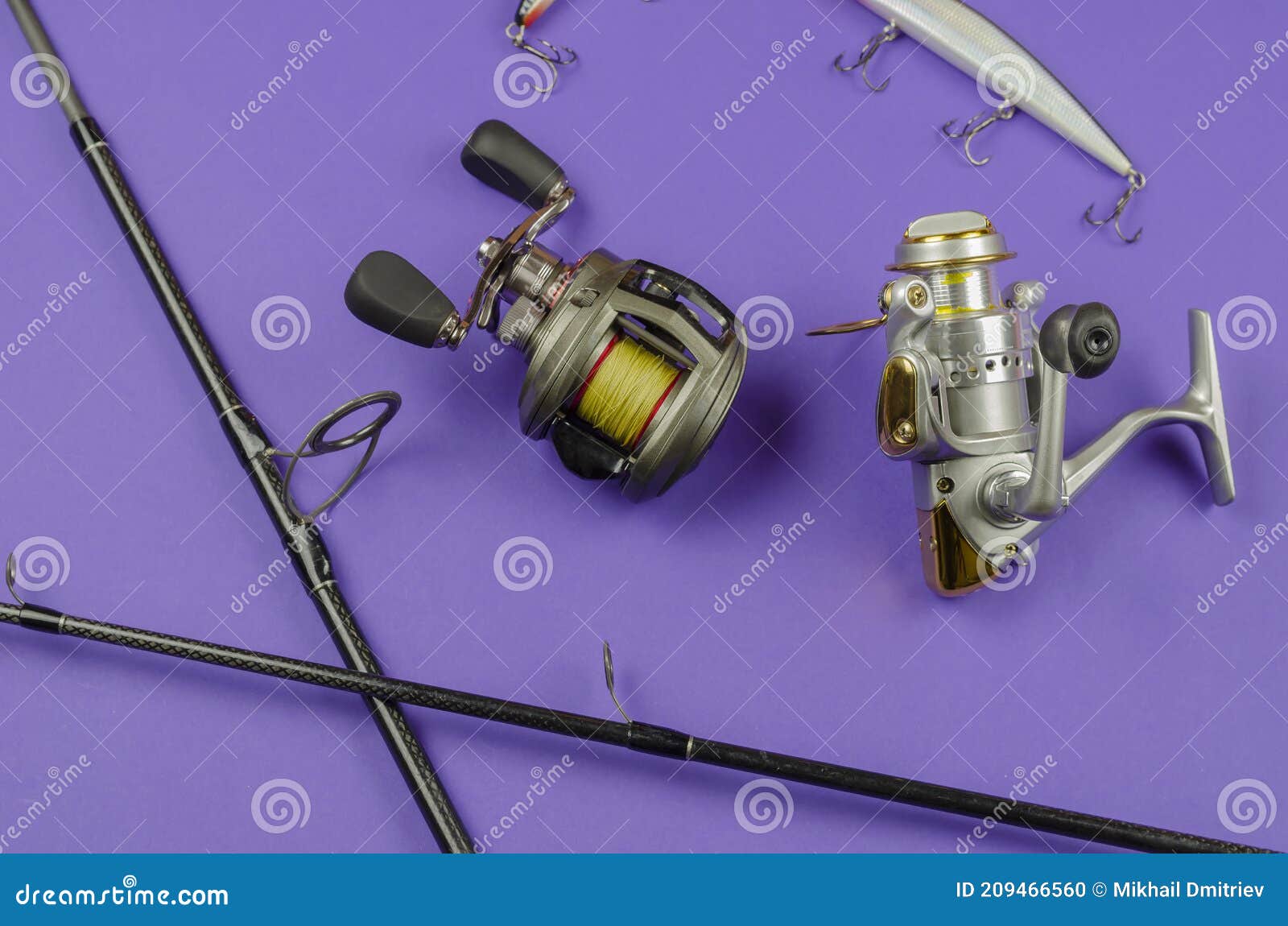 Fishing Rod Fly Fishing Reel, Baitcasting Reel and Baits on Blue