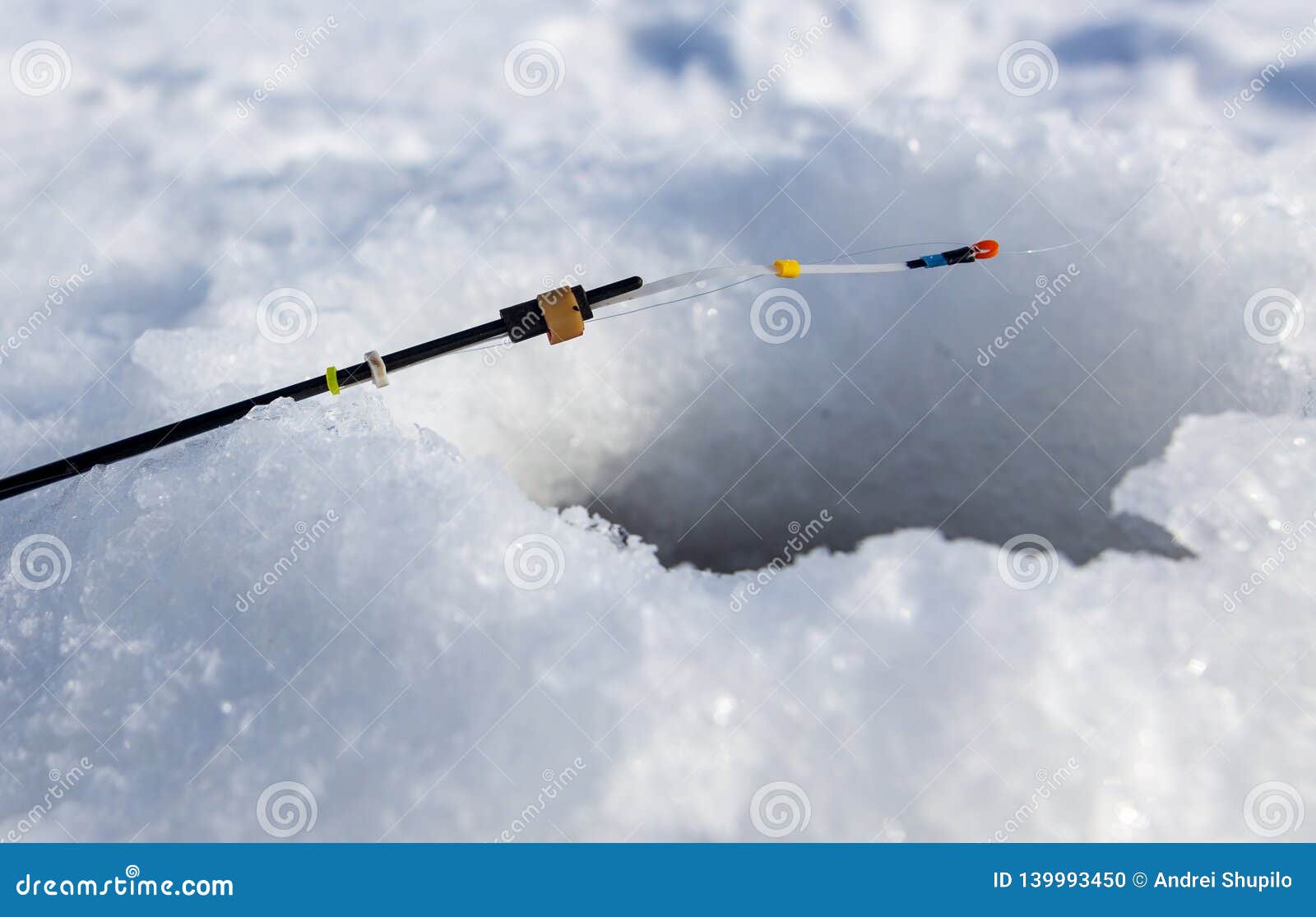 Fishing Rod Near the Hole in the Ice Stock Photo Image of pond