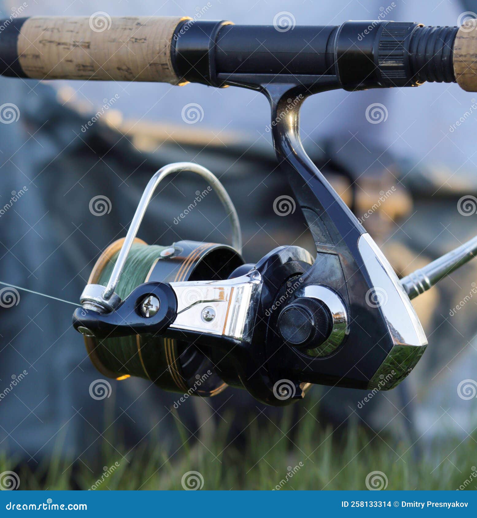 Fishing Rod and Reel for Catching Fish Close-up on a Blurry Background.  Inertia-free Reel and Fishing Line Stock Photo - Image of concept, fitness:  258133314