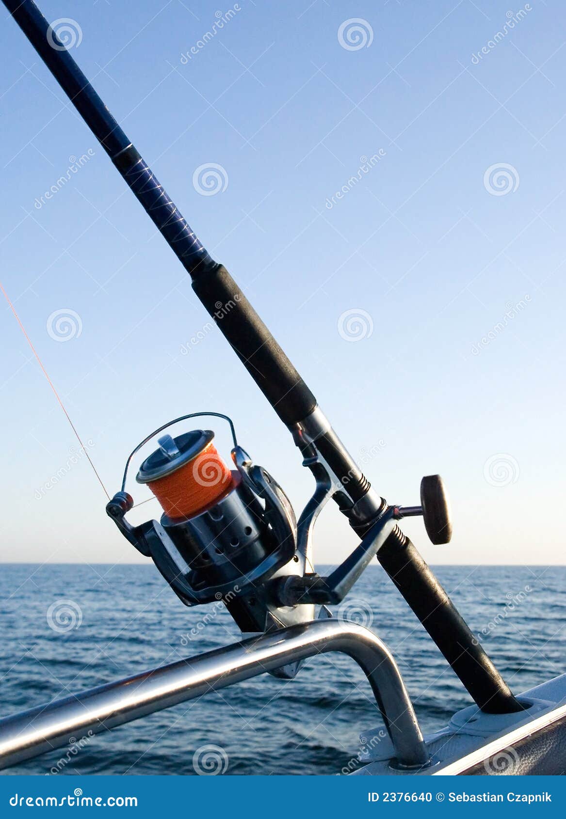 Fishing rod reel at sea. stock photo. Image of deep, rail - 2376640
