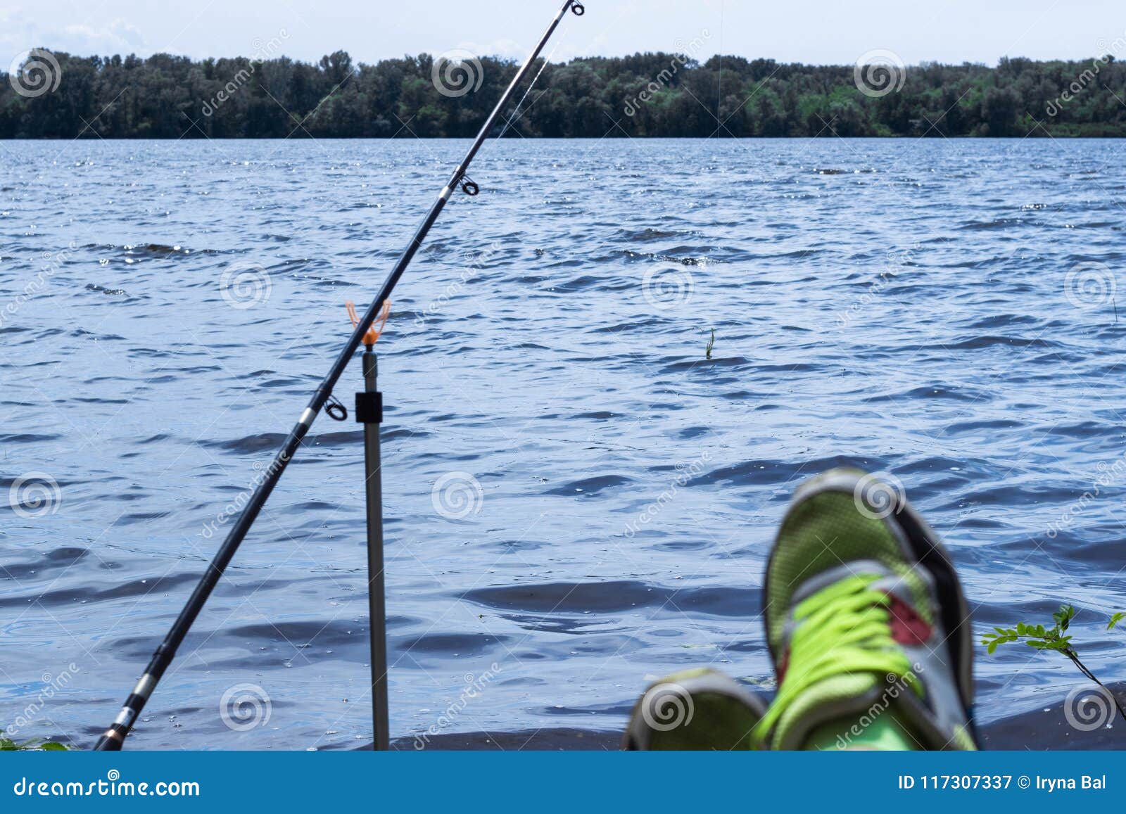 https://thumbs.dreamstime.com/z/fishing-rod-thrown-water-bank-river-fishing-rod-stands-fishing-line-fishing-gear-117307337.jpg